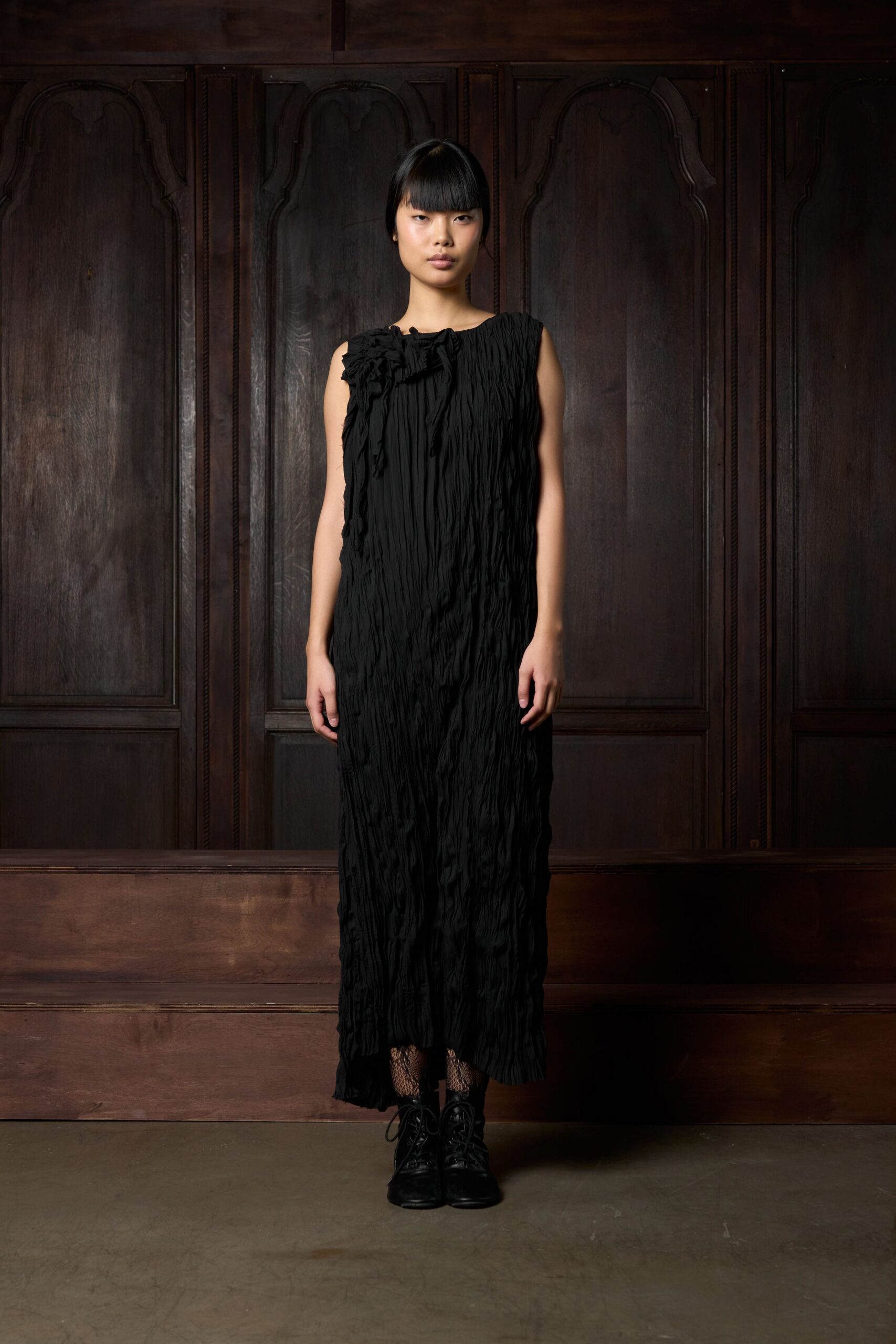 black silk sleeveless high-neck fitted pleated flowing dress