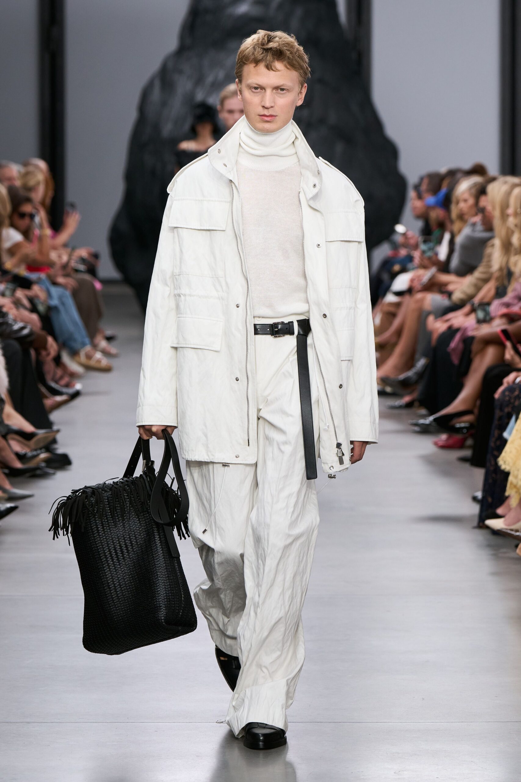 white relaxed coat with black bag