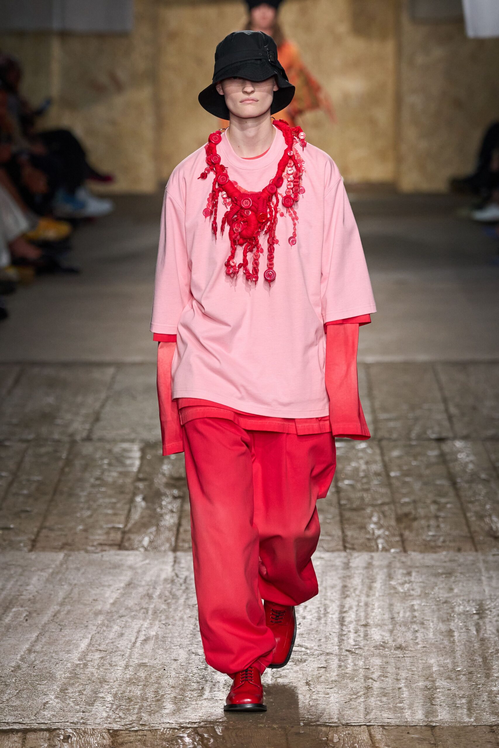 pink relaxed top with red pants