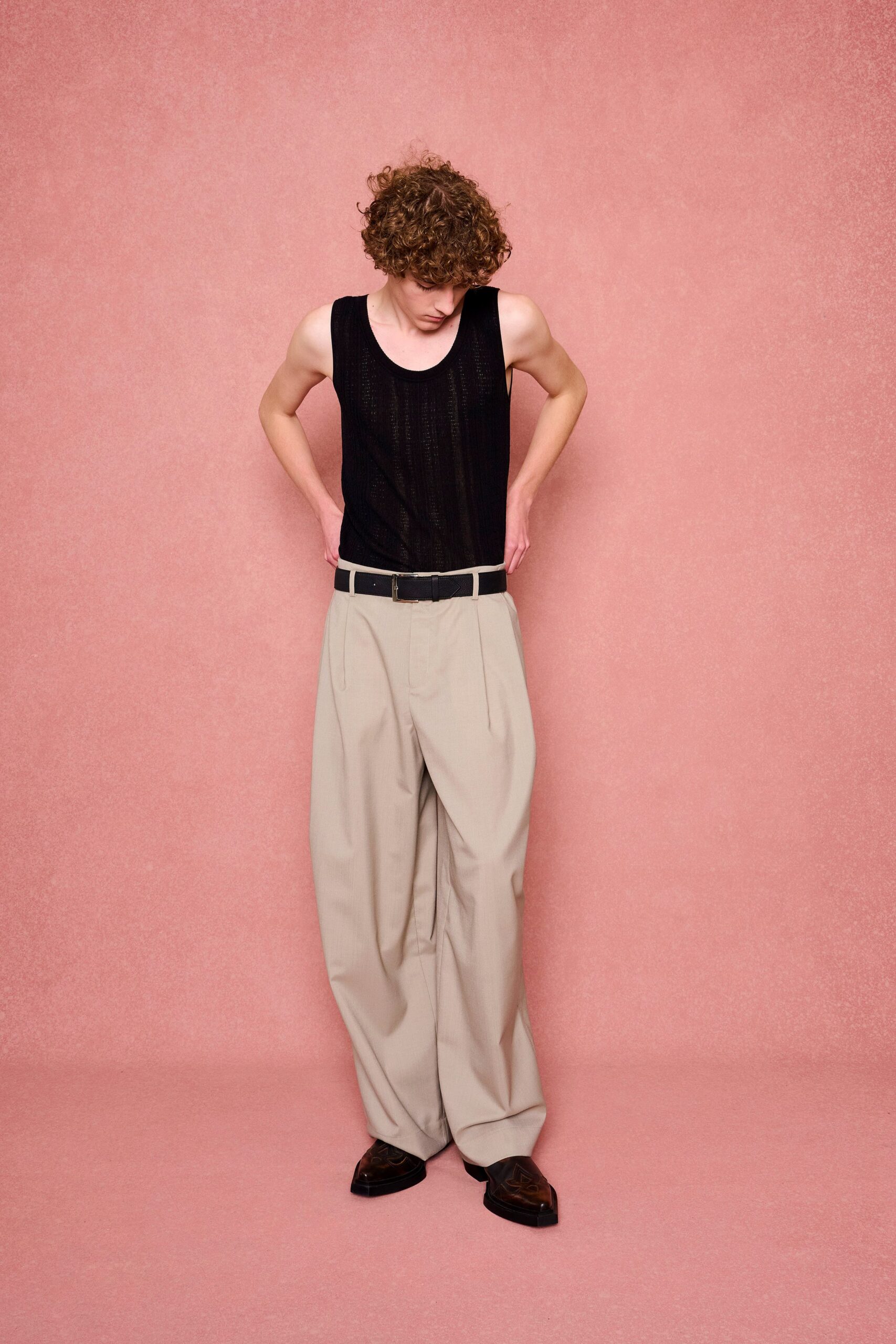 black tank-top beige pants