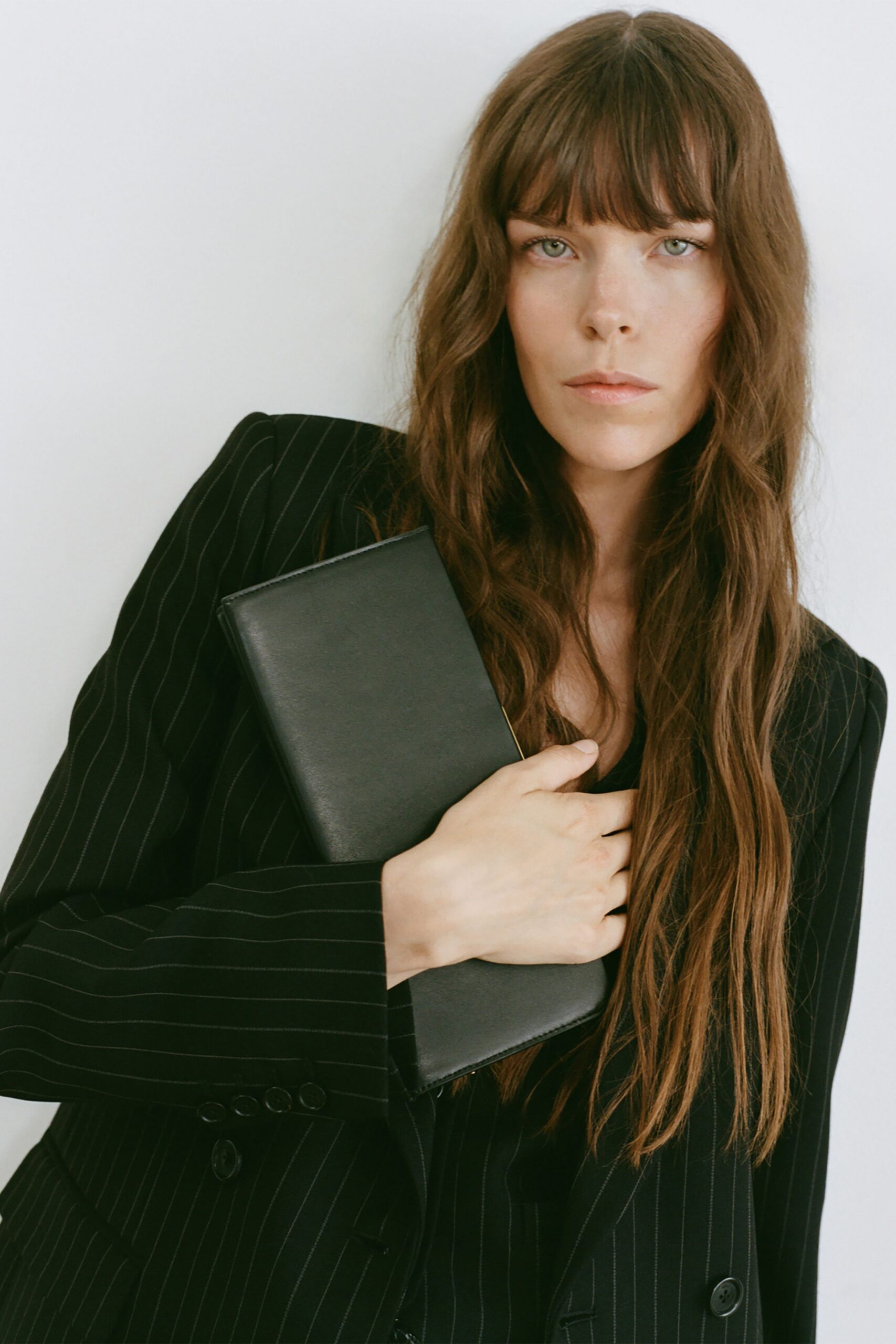 black tailored blazer with clutch