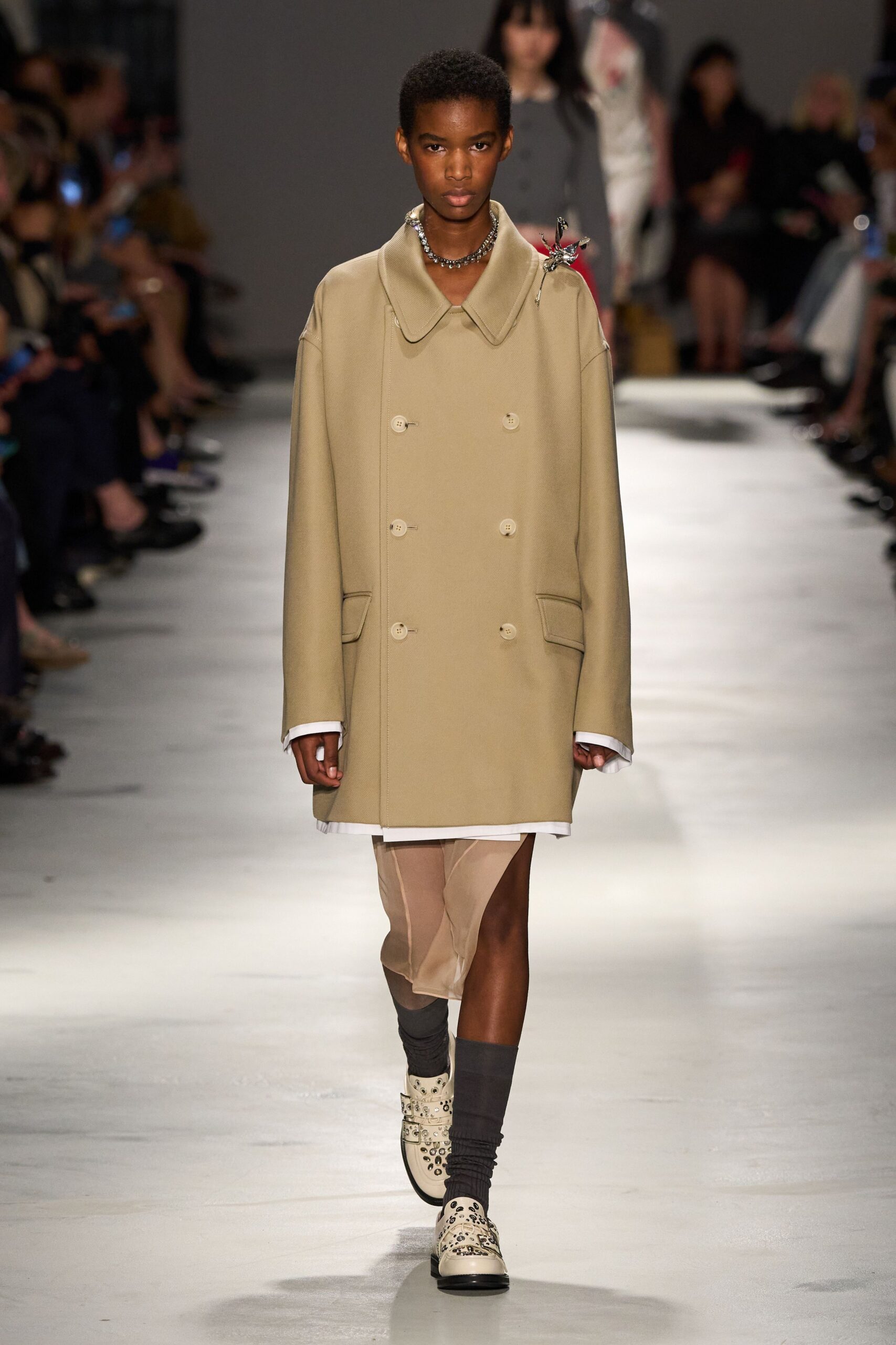 beige oversized coat with white dress