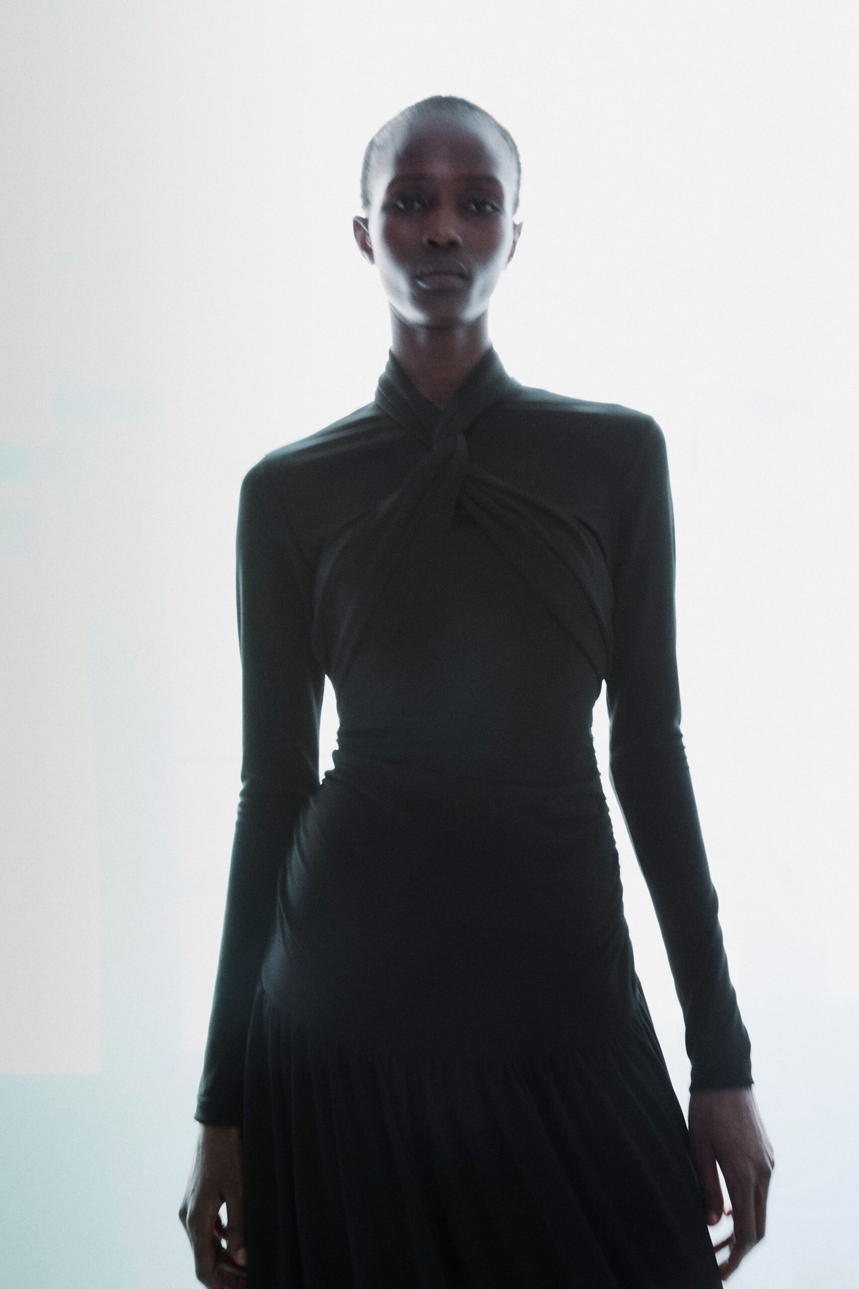 black fitted long-sleeve dress