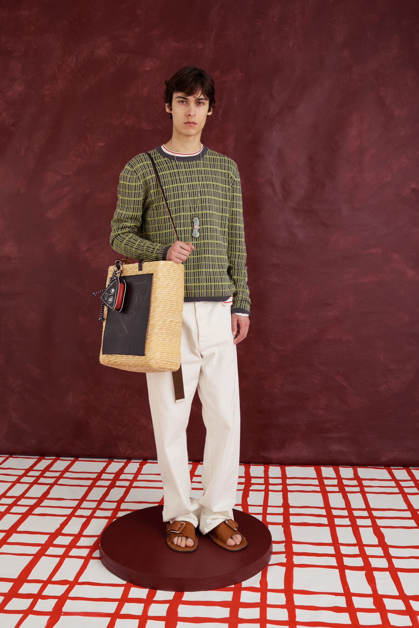 green striped sweater with white pants
