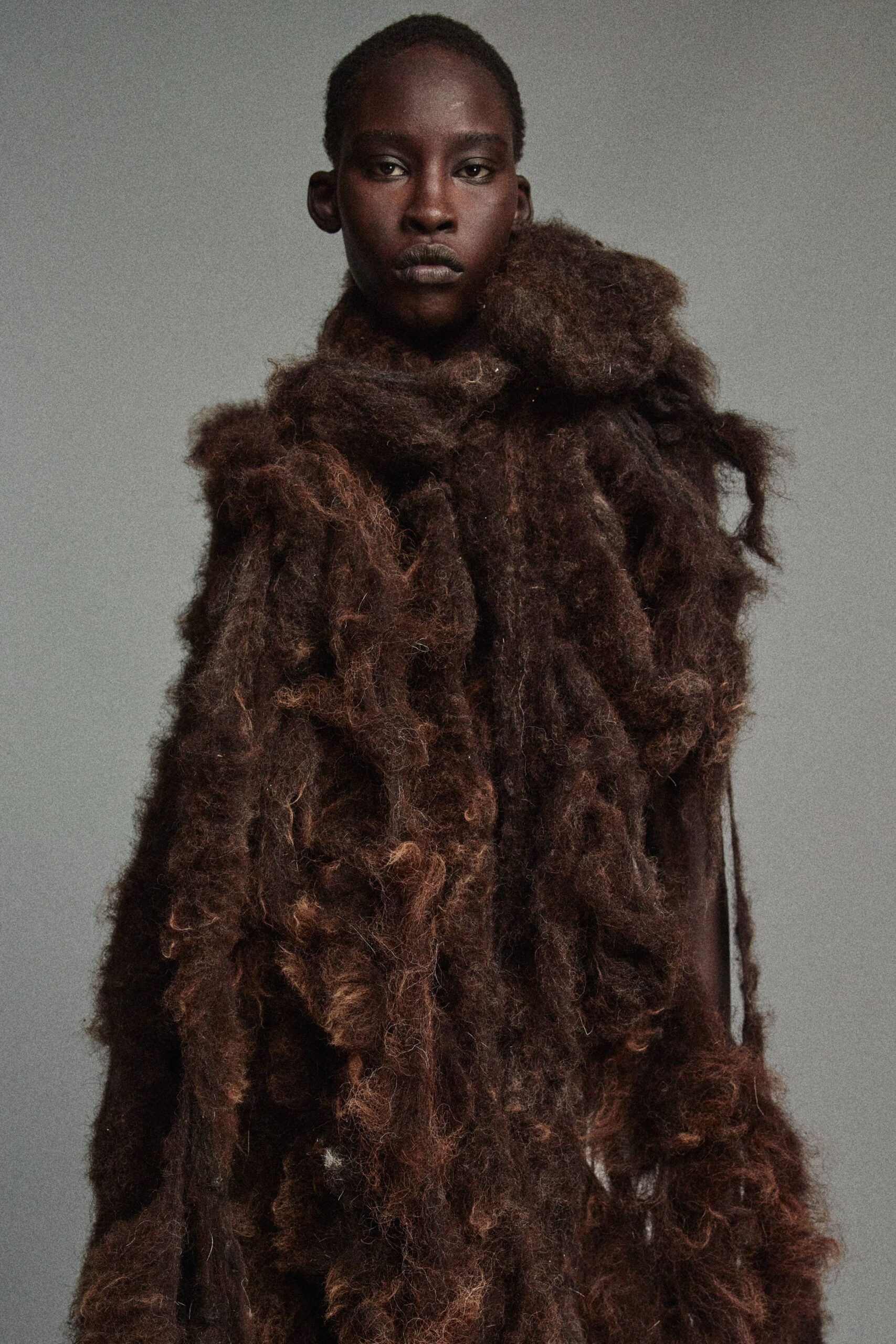 brown fringed fur cape