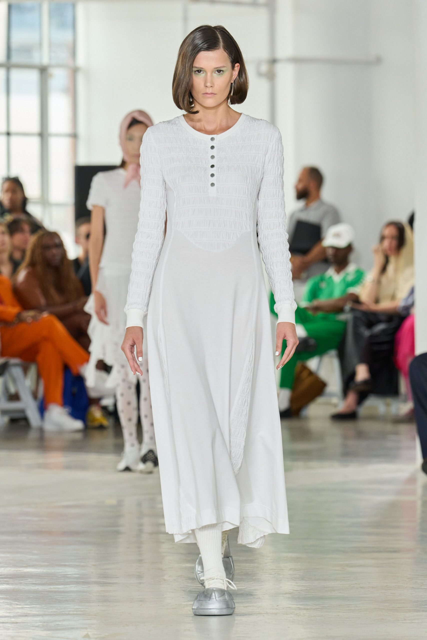 white fitted midi dress with silver shoes