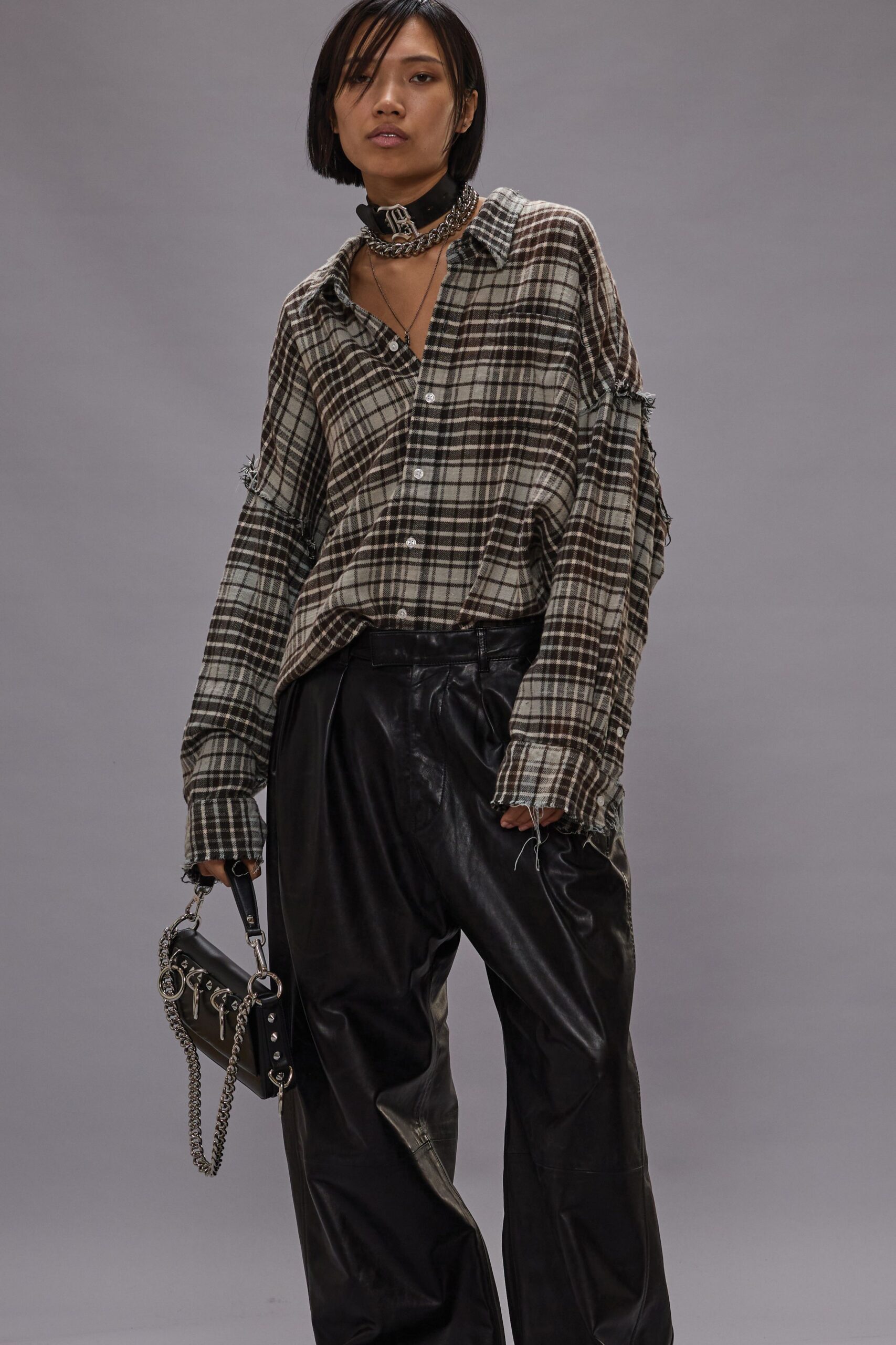 checked shirt with leather pants