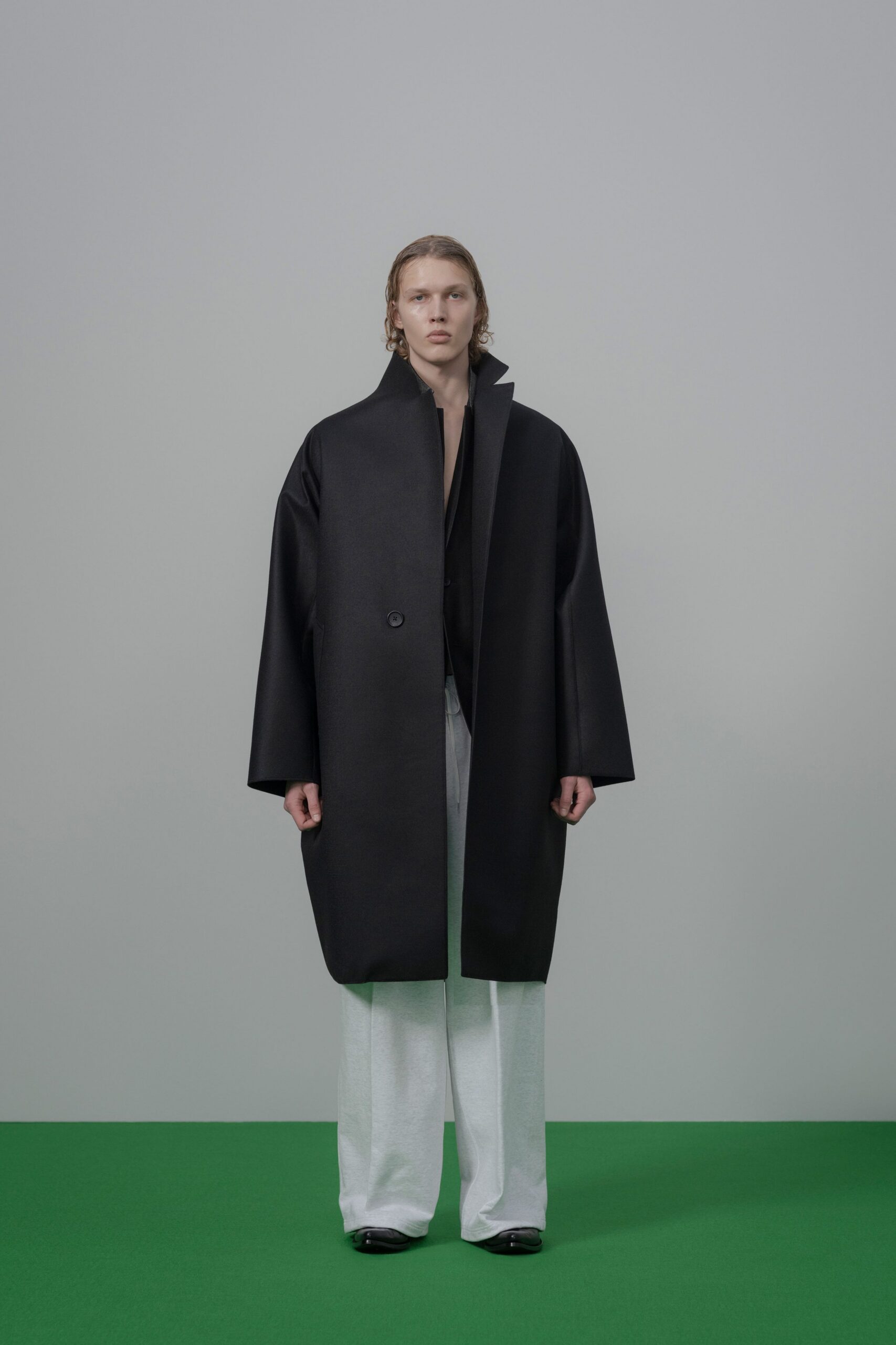 black wool long-sleeve collared oversized buttoned coat