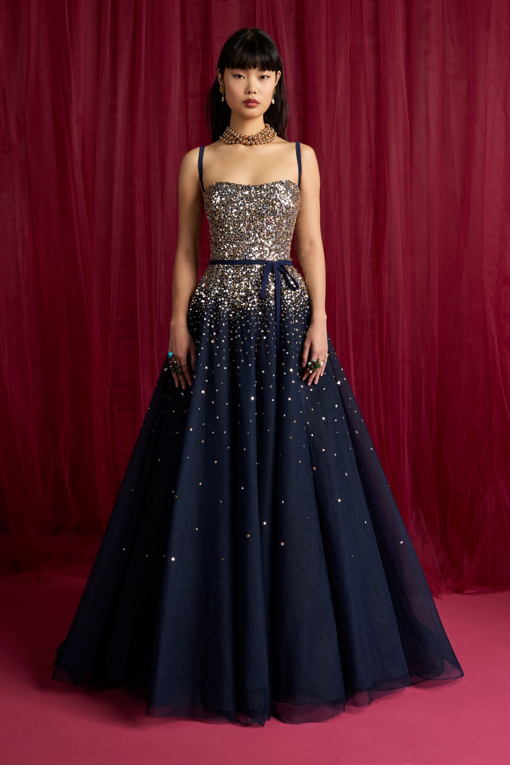 navy sequined sleeveless gown
