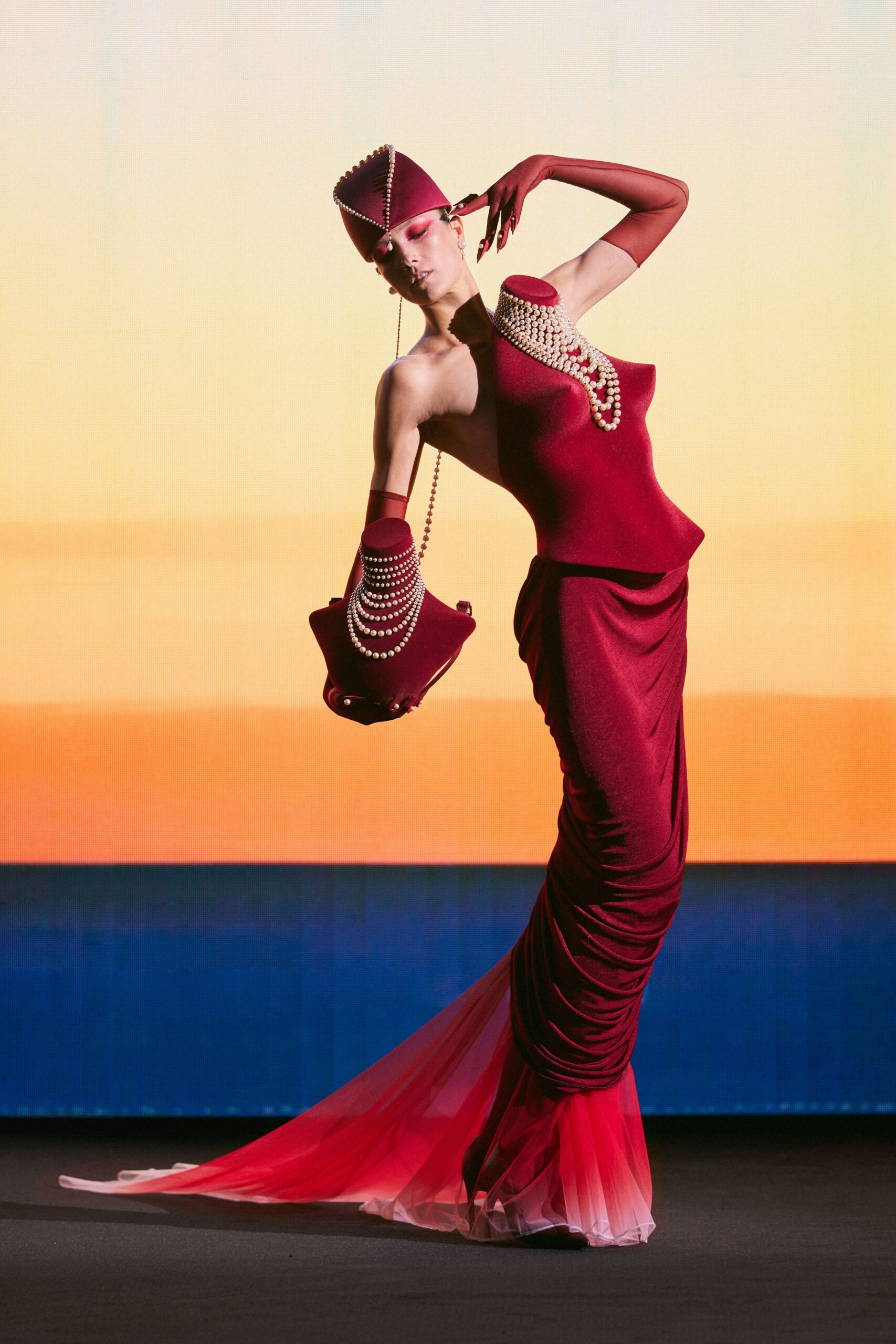red silk sleeveless high-neck fitted ruched layered gown