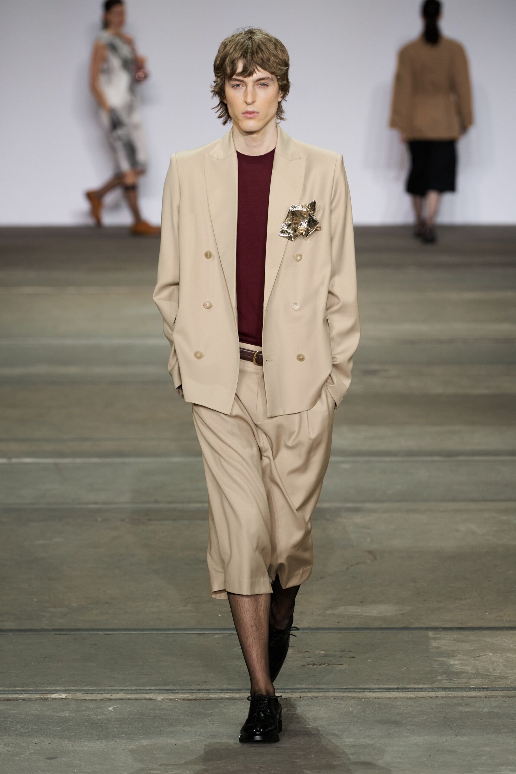 beige relaxed suit with red shirt