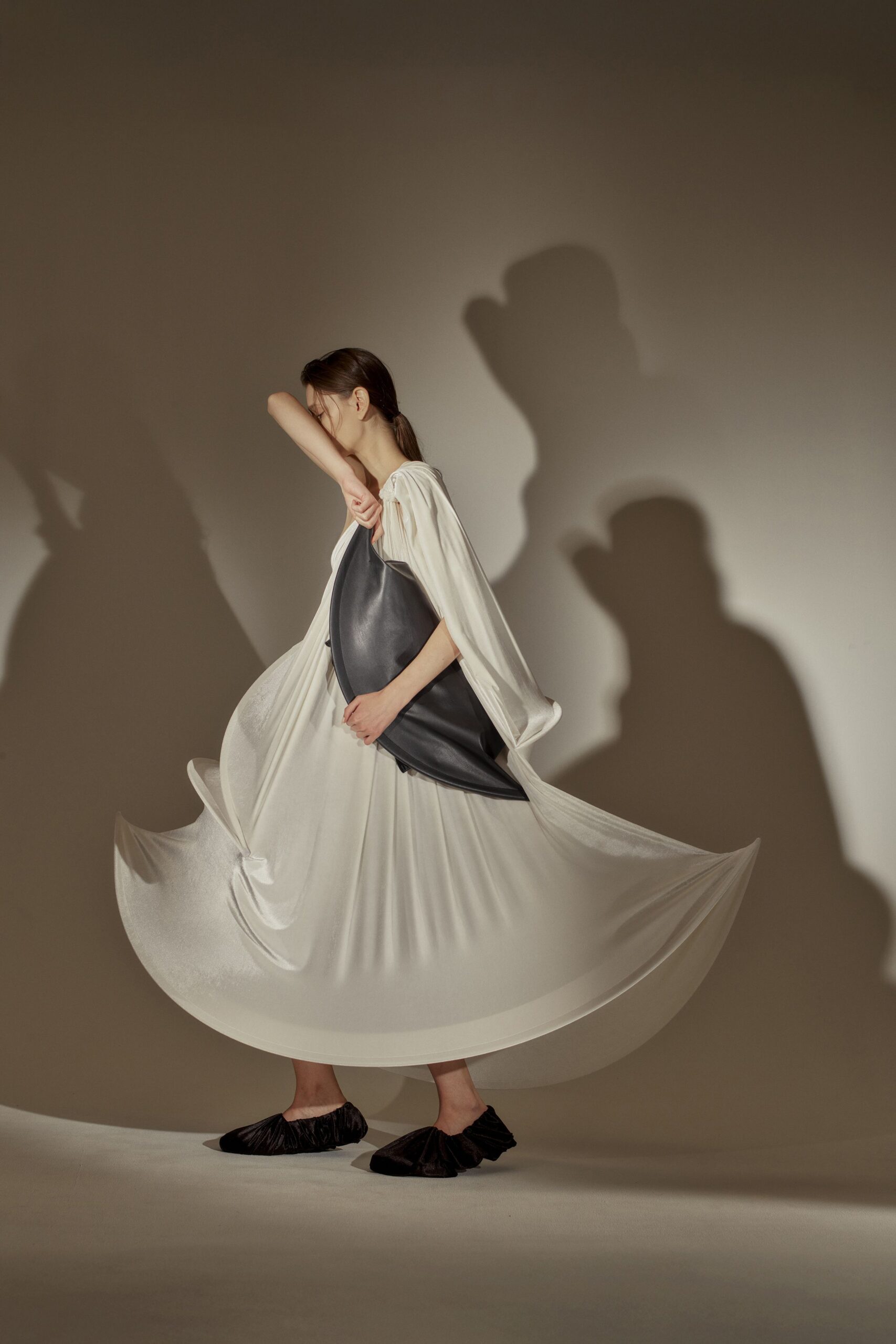 white pleated midi dress with black shoes