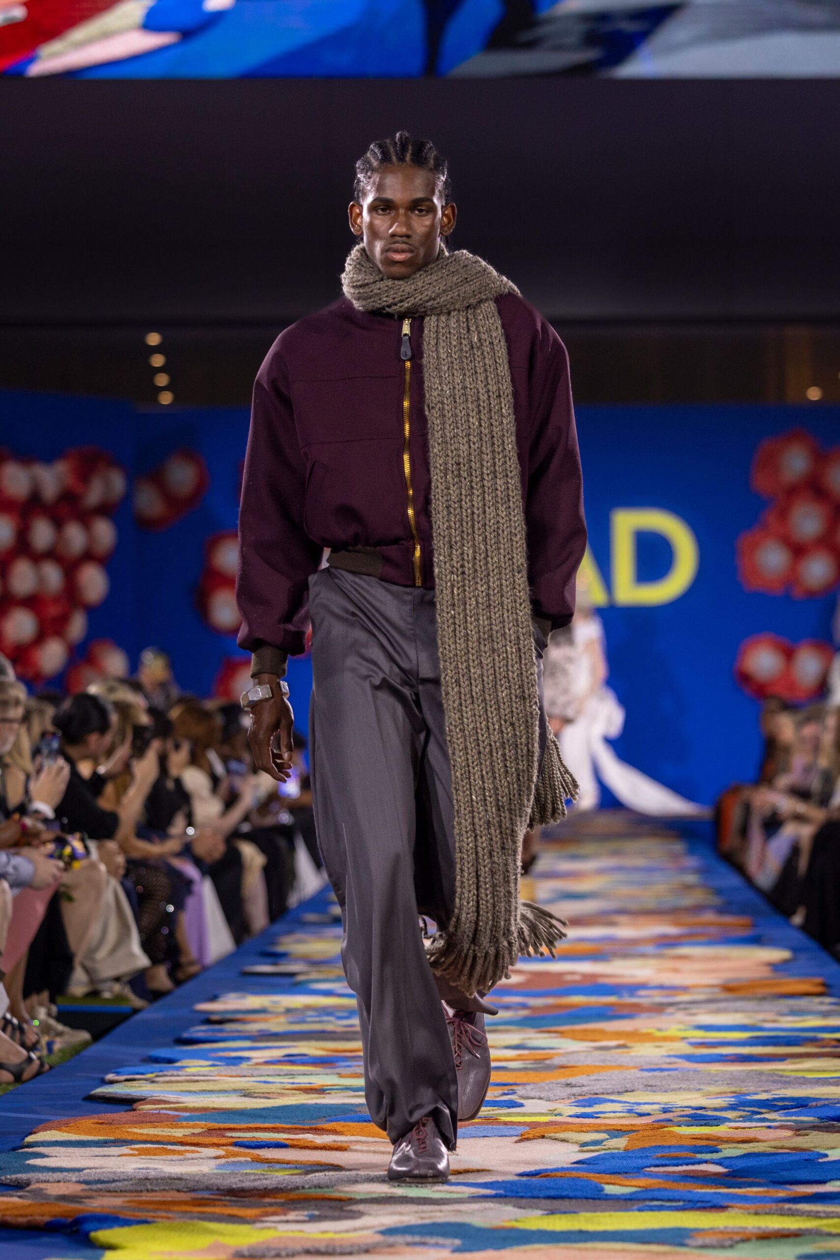 maroon shirt gray pants with scarf