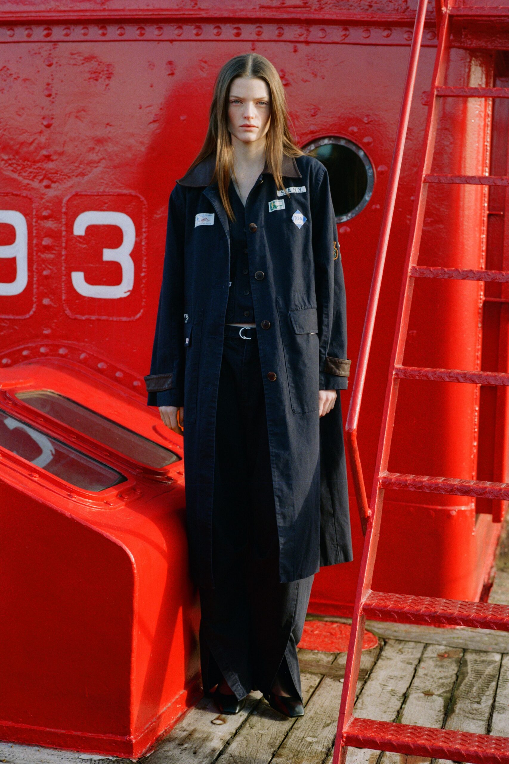 black relaxed coat and fitted pants