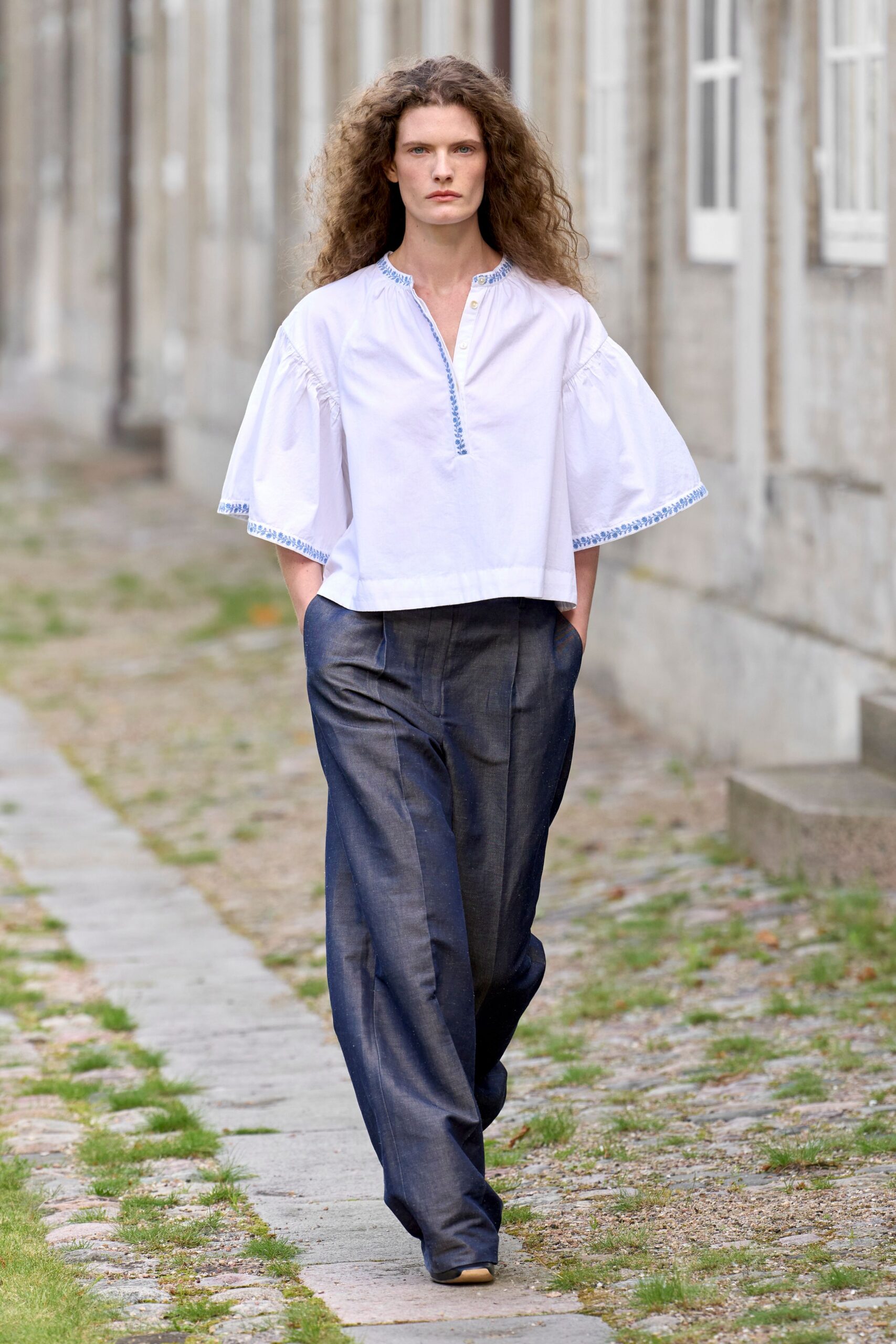 white relaxed top with blue pants