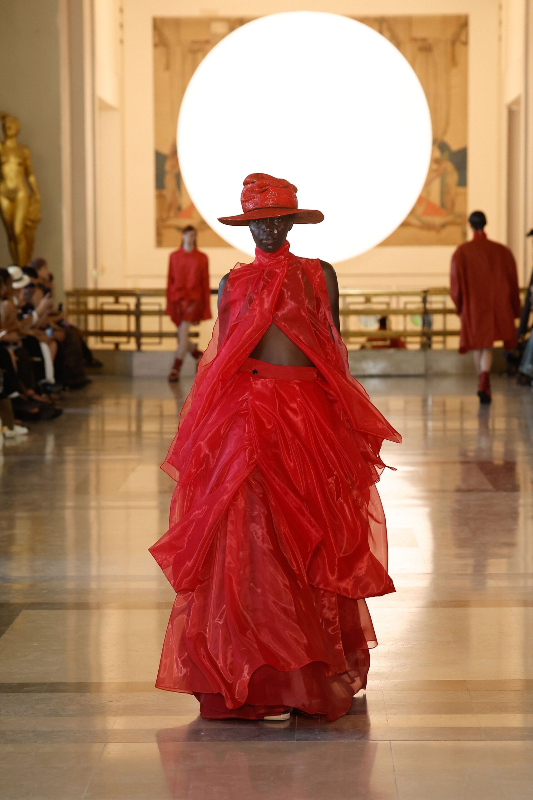 red silk sleeveless high-neck fitted layered gown