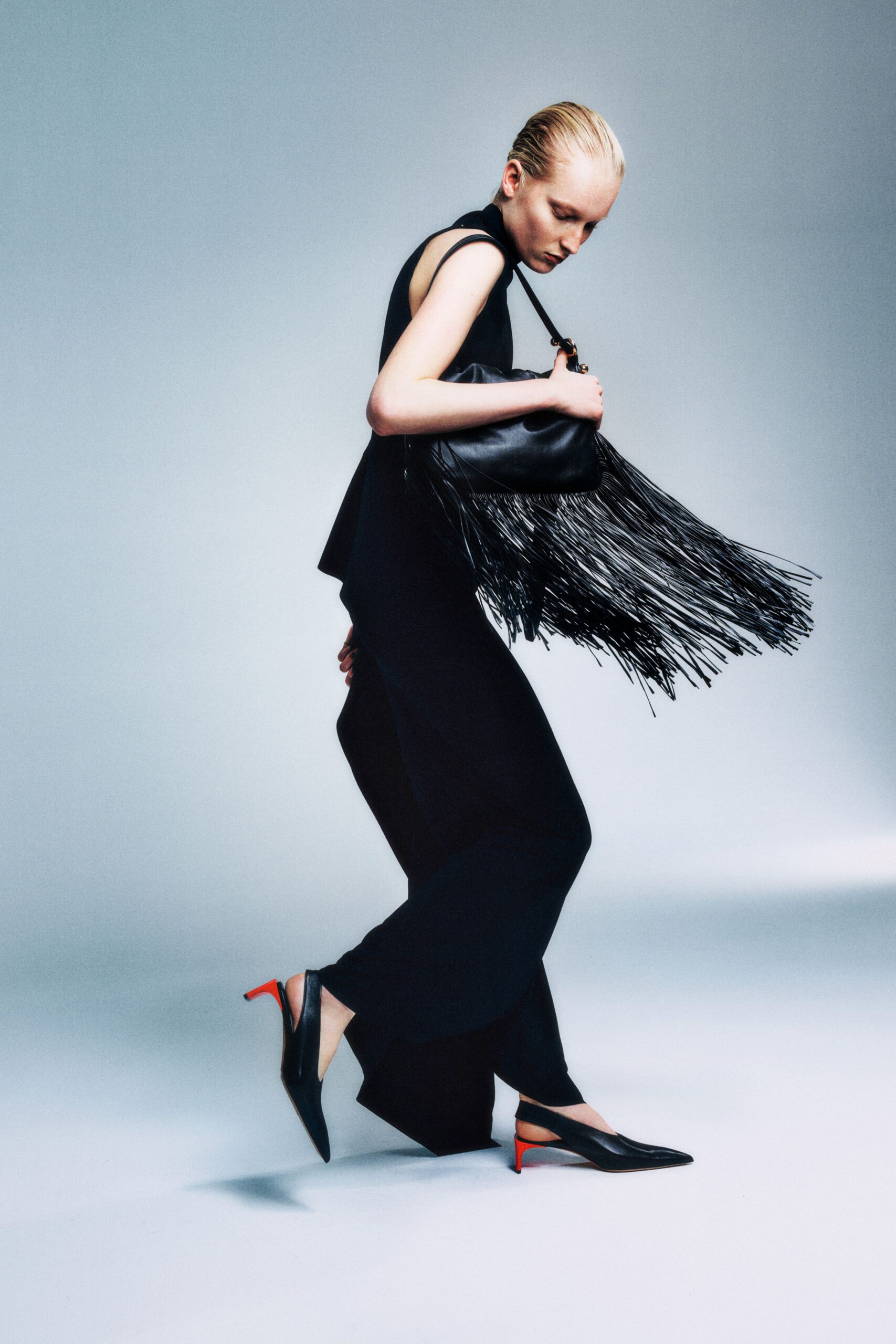 black silk sleeveless high-neck fitted fringed top