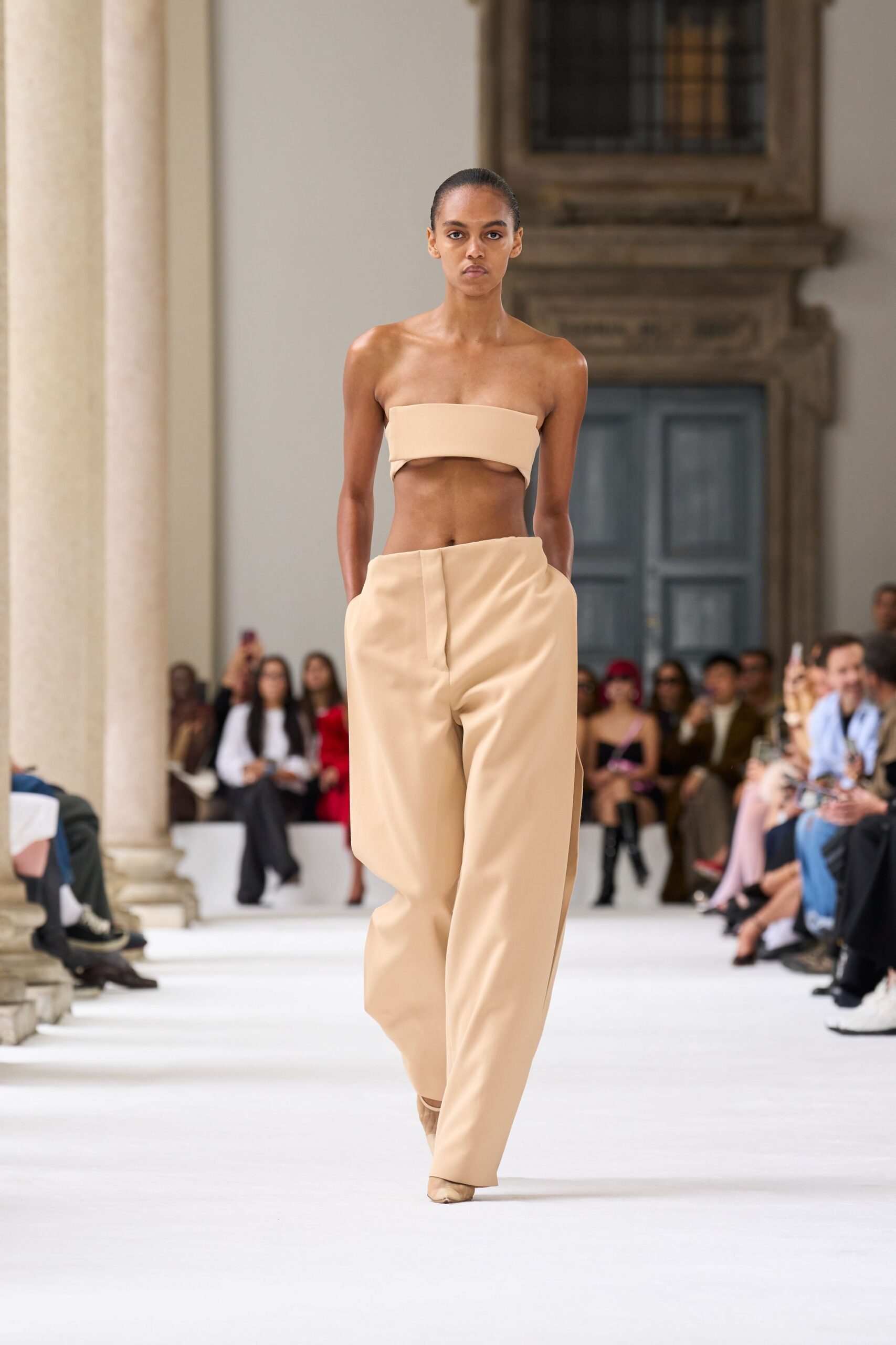 beige strapless top and wide-leg pants