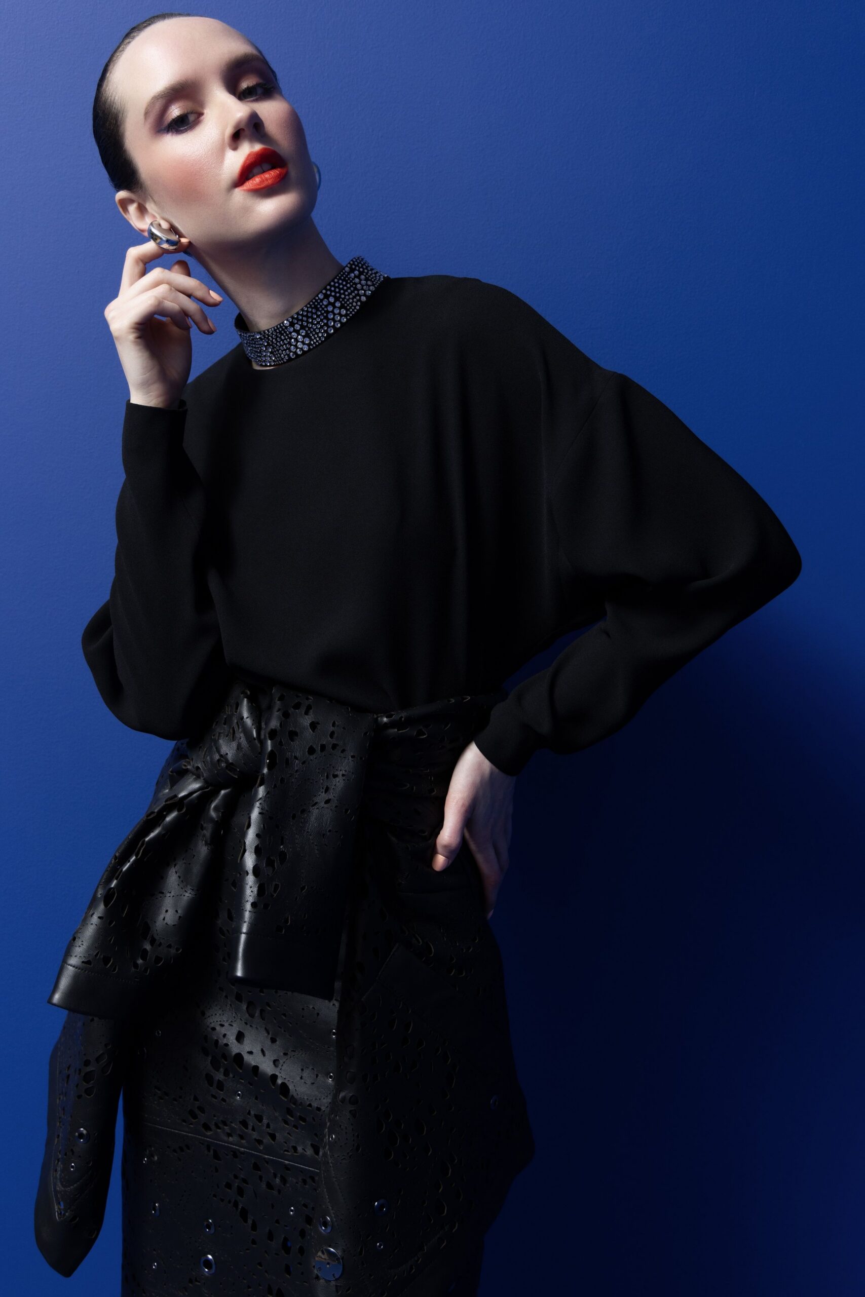 black relaxed top with fitted skirt