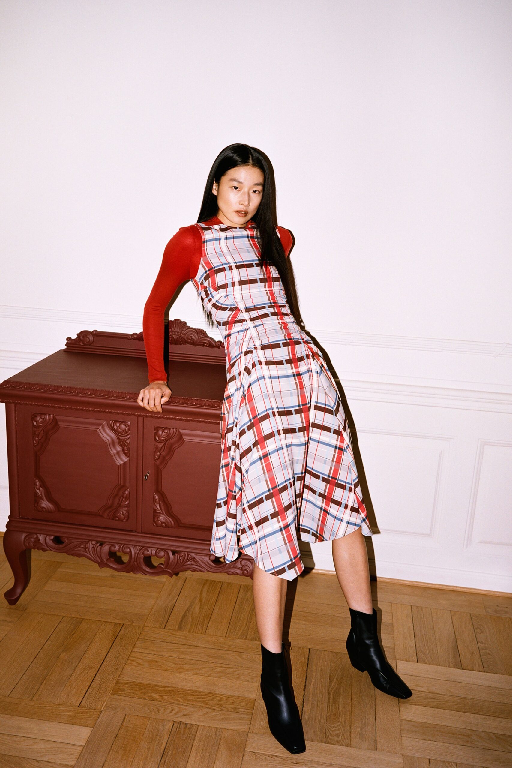 red and black checked midi dress with boots