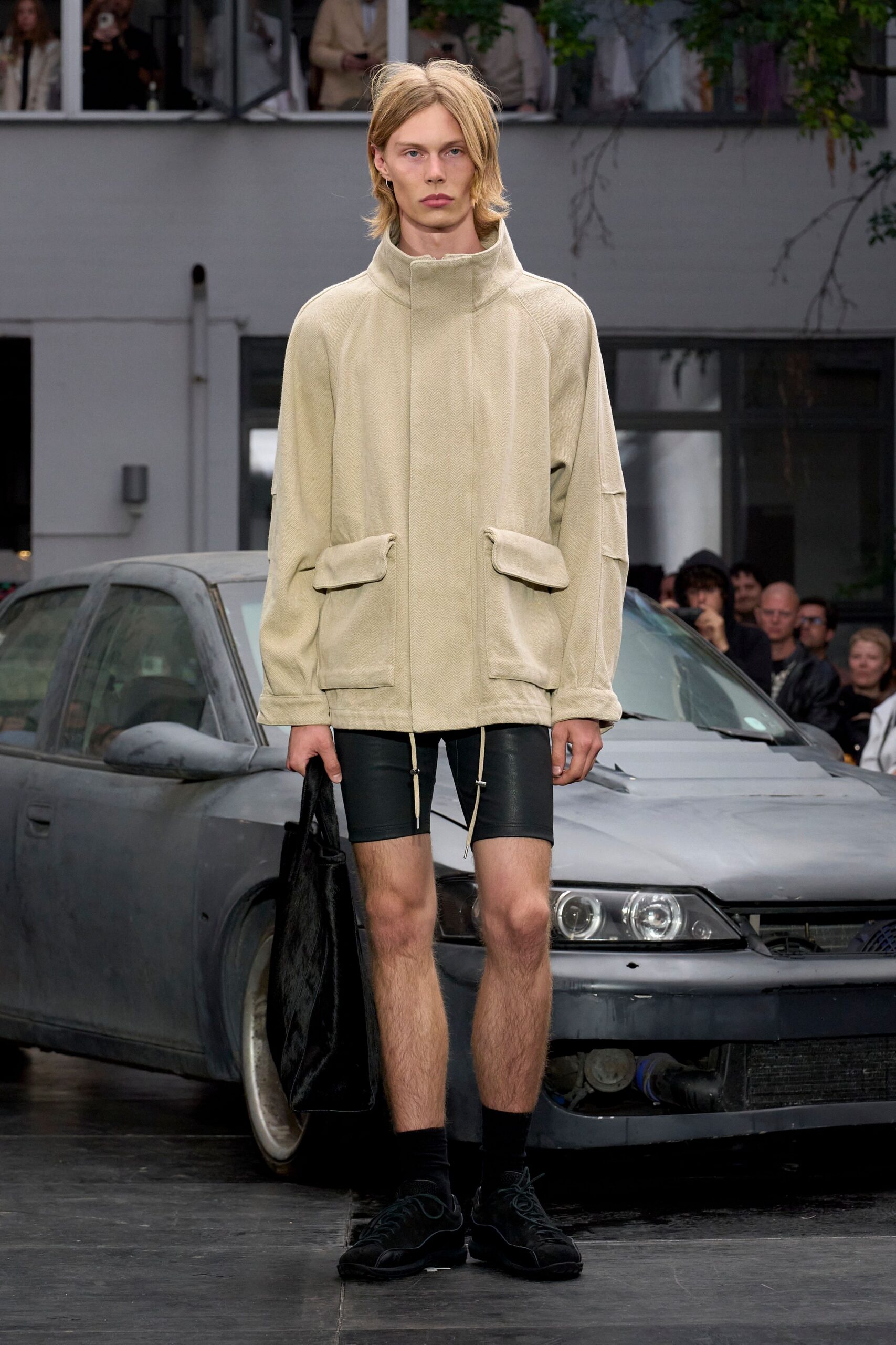 beige relaxed jacket with black shorts