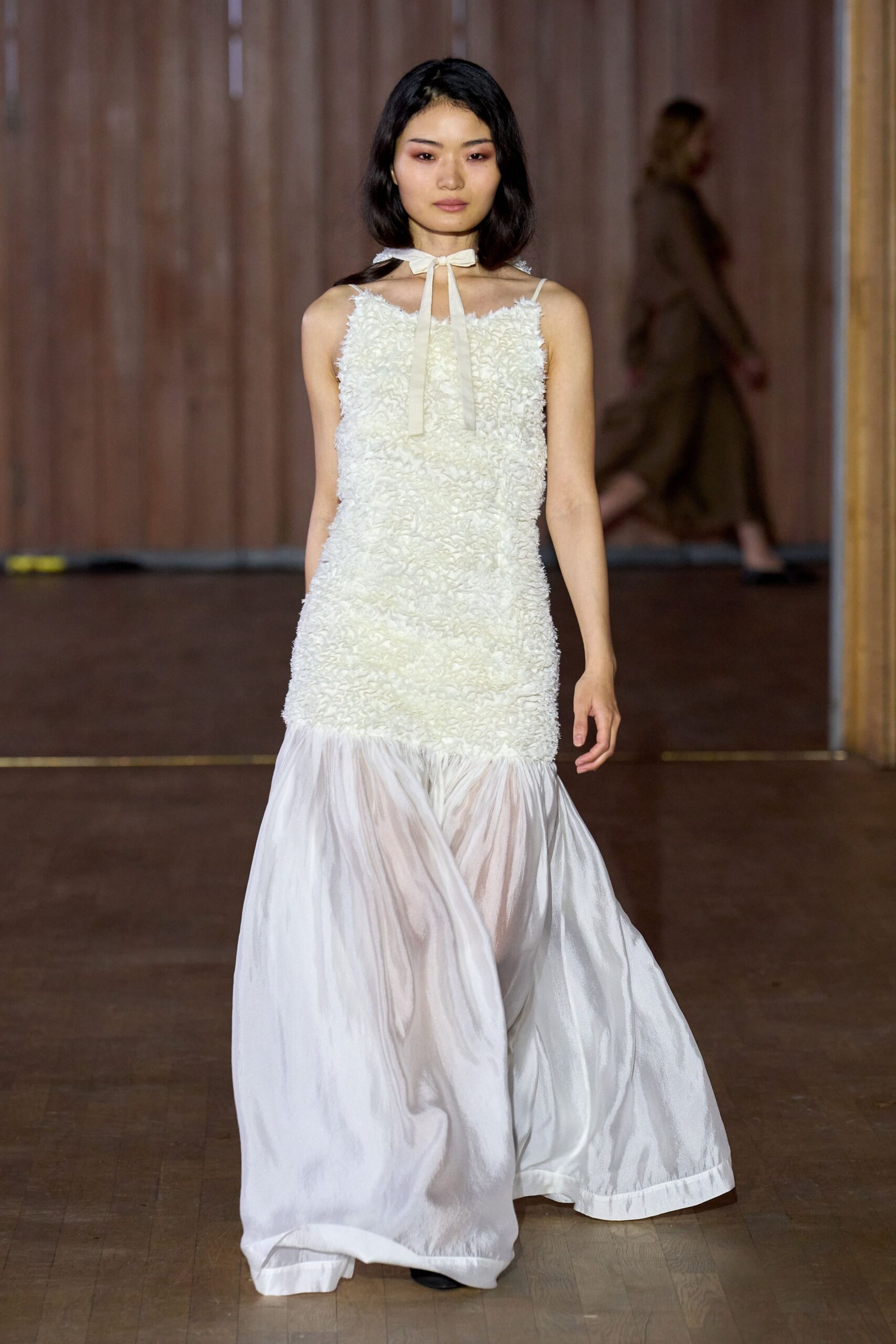 white ruffled sleeveless dress