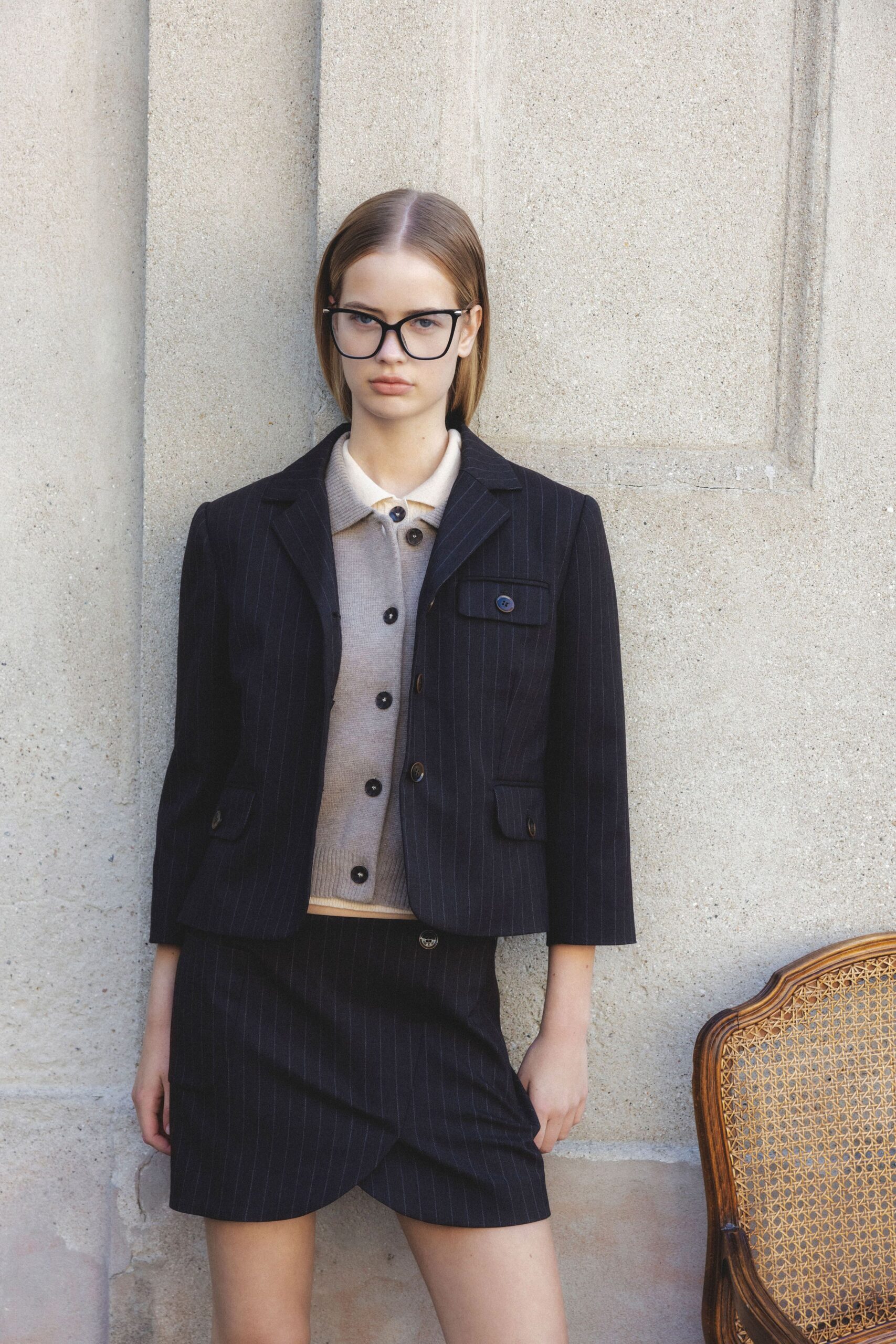 black blazer beige shirt black skirt