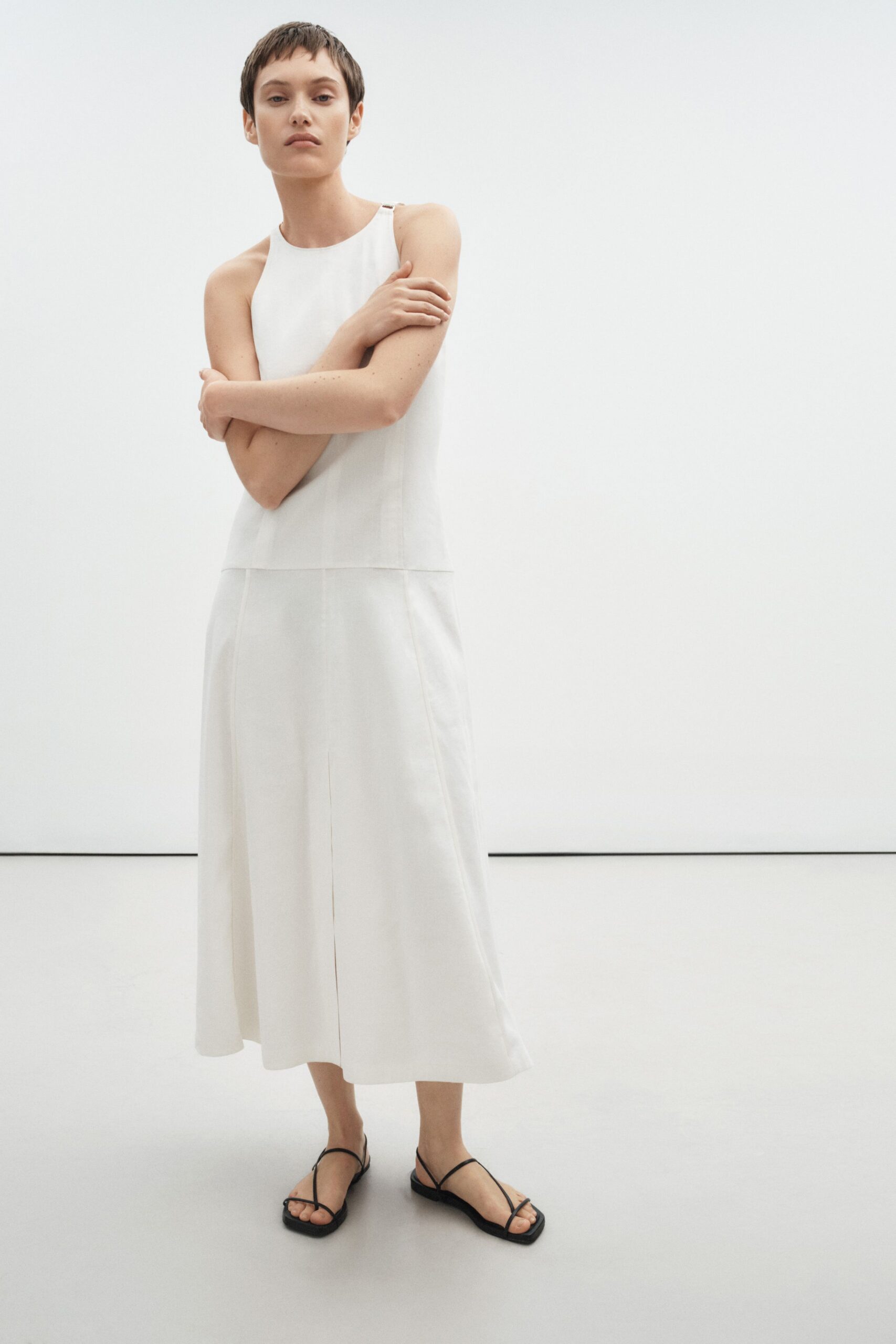 white sleeveless midi dress with black sandals