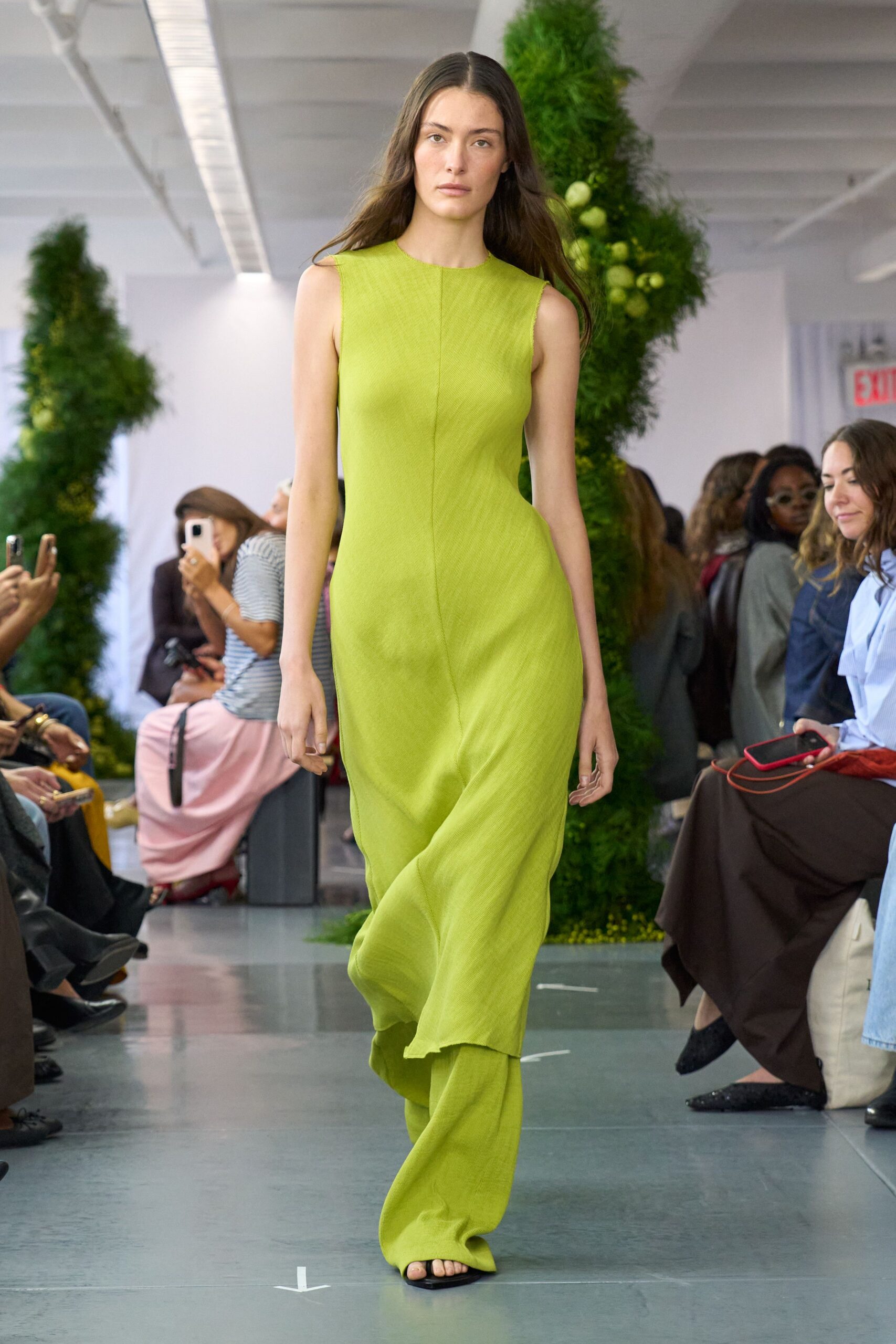 green silk sleeveless high-neck fitted draped flowing gown