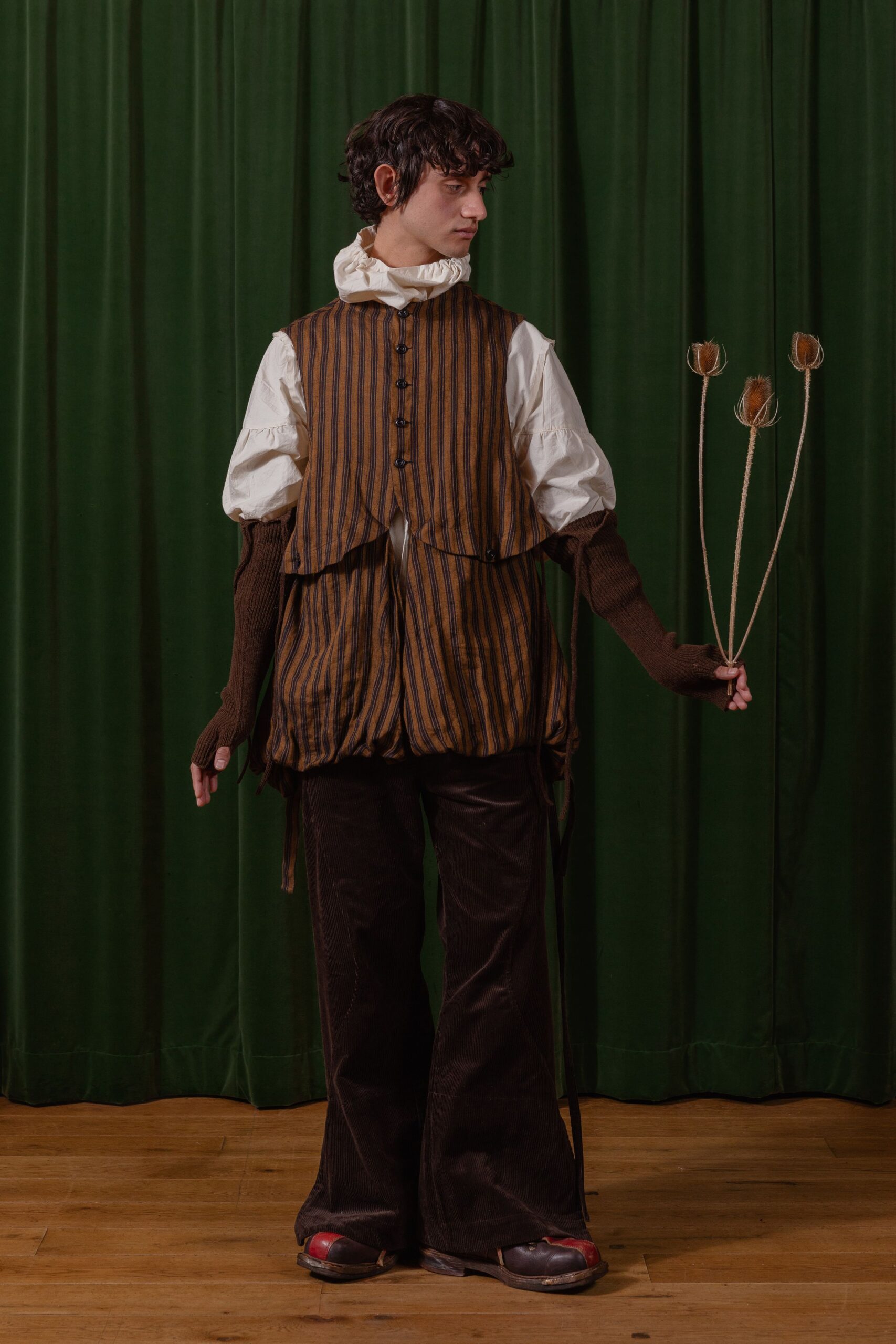 brown striped vest with white shirt