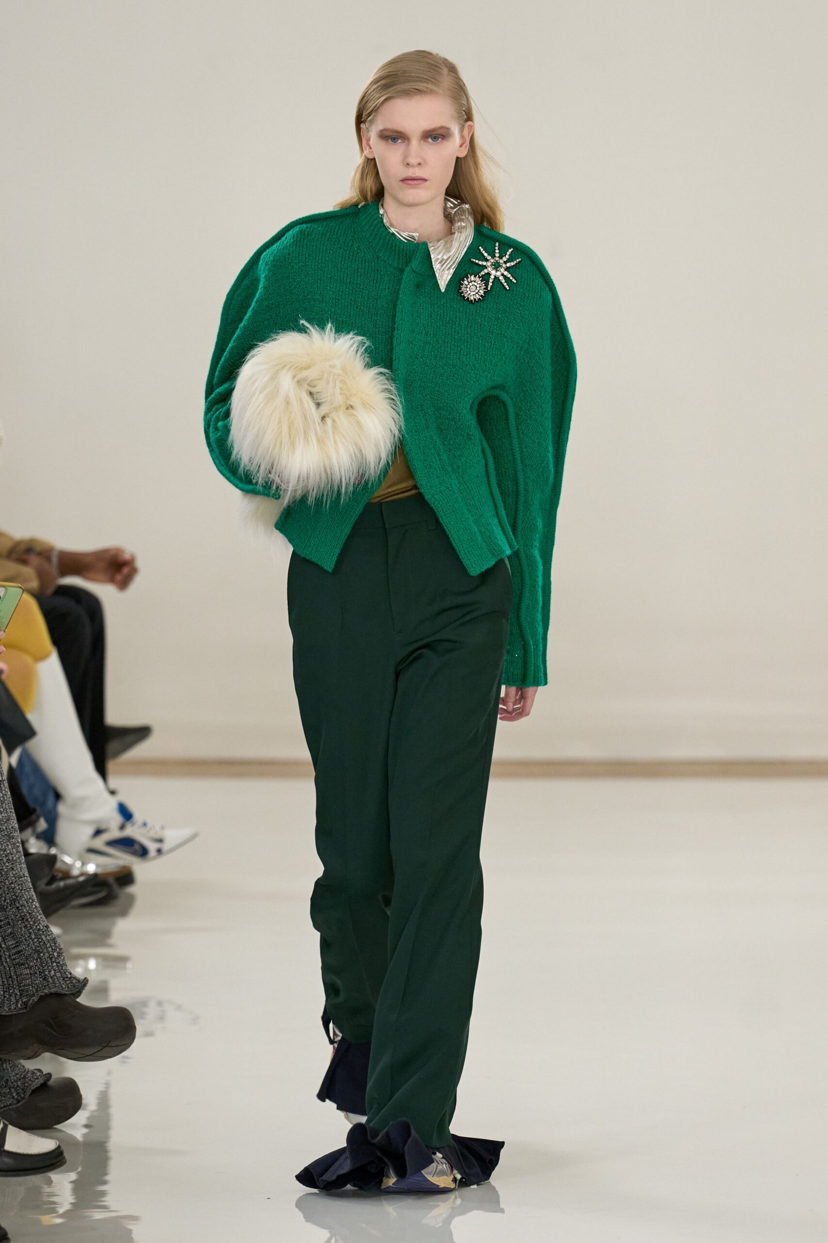 green wool sweater with tailored pants