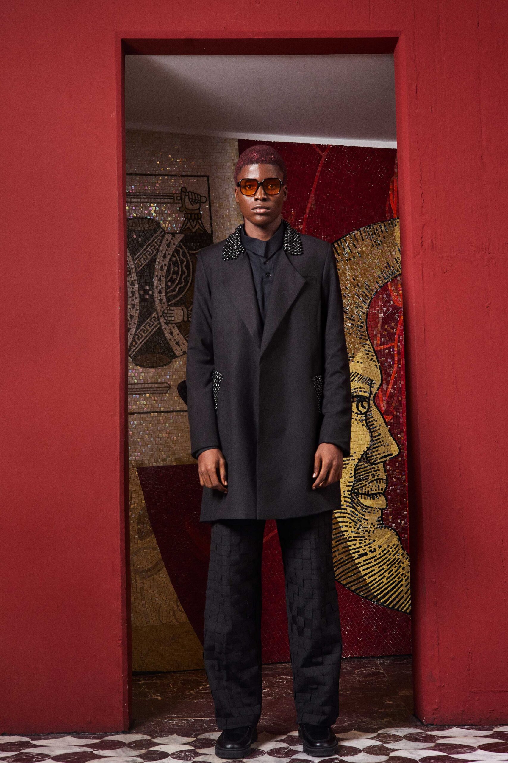 black structured coat with sunglasses