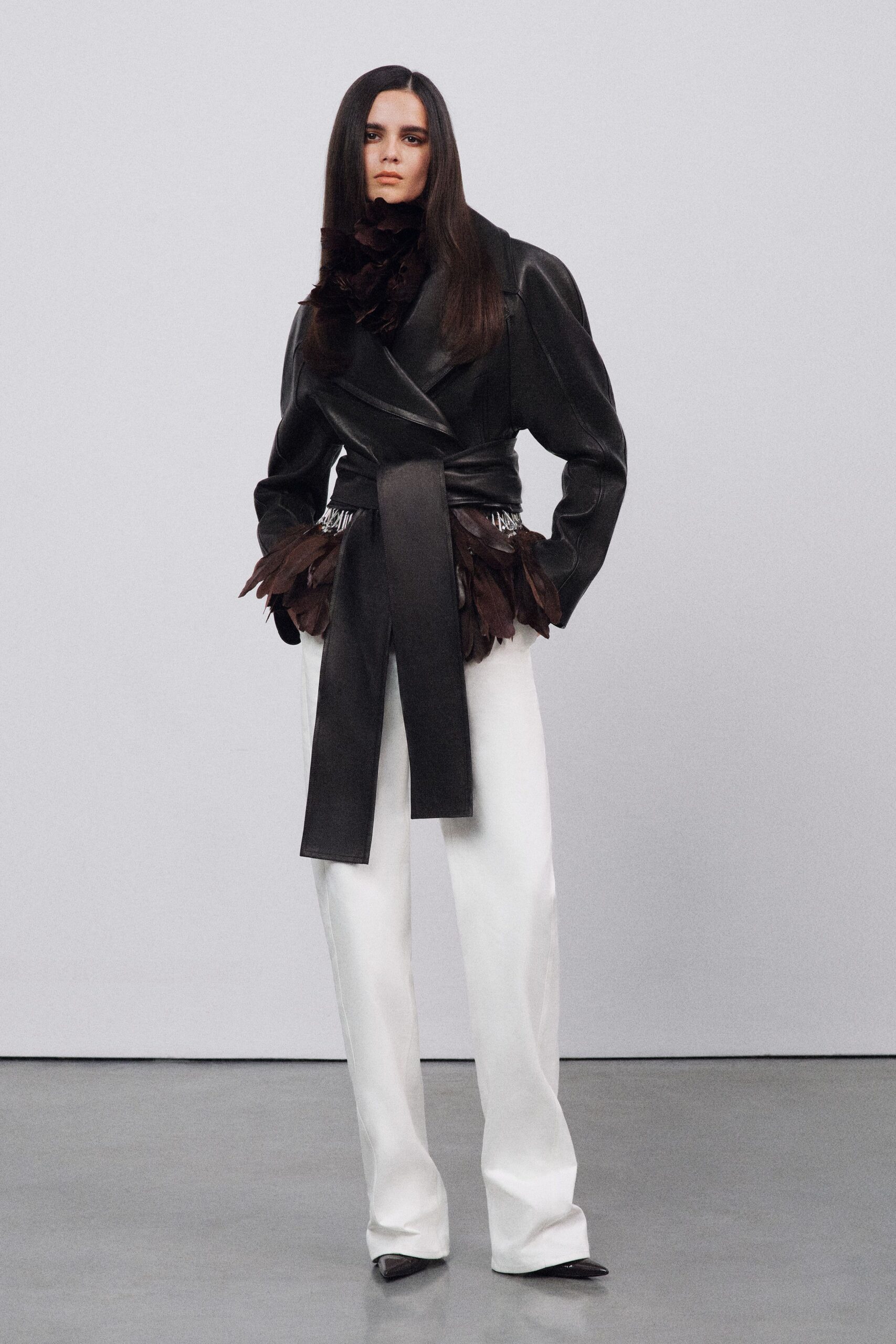 black leather long-sleeve collared fitted ruffled belted jacket