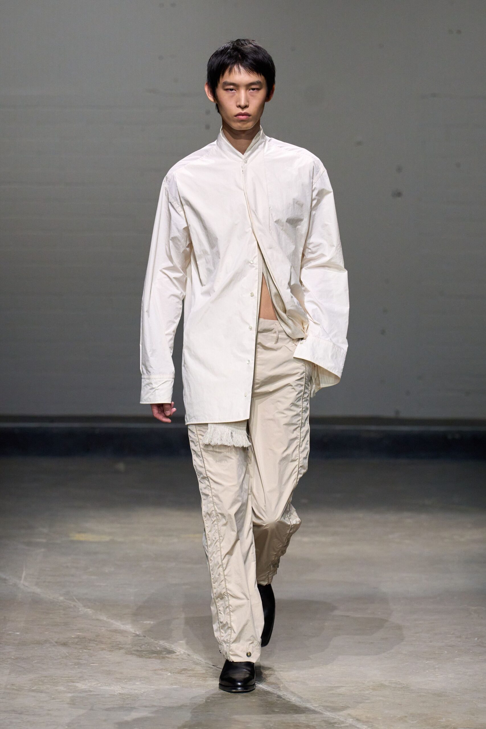 white relaxed shirt beige pants