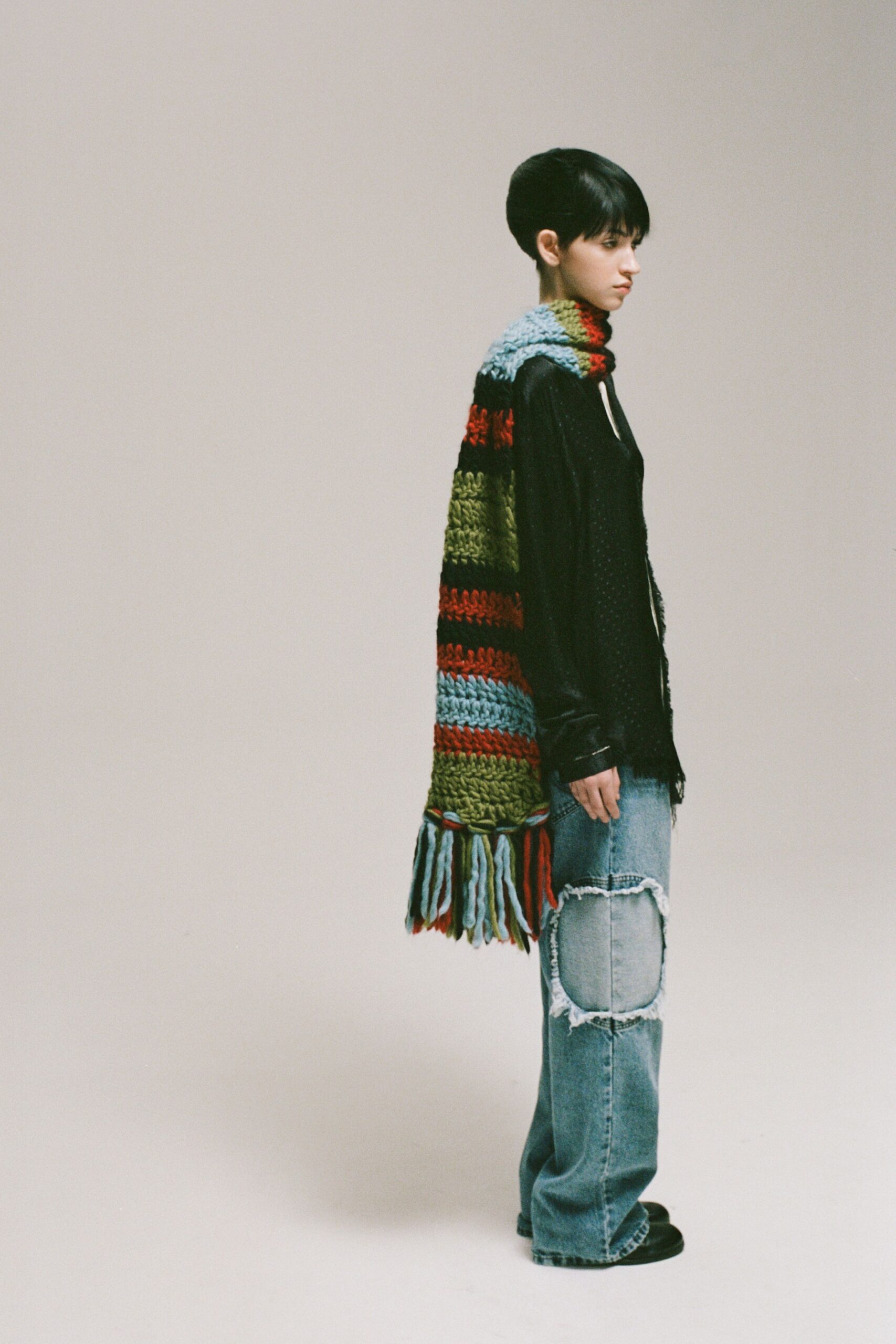 black shirt blue distressed pants