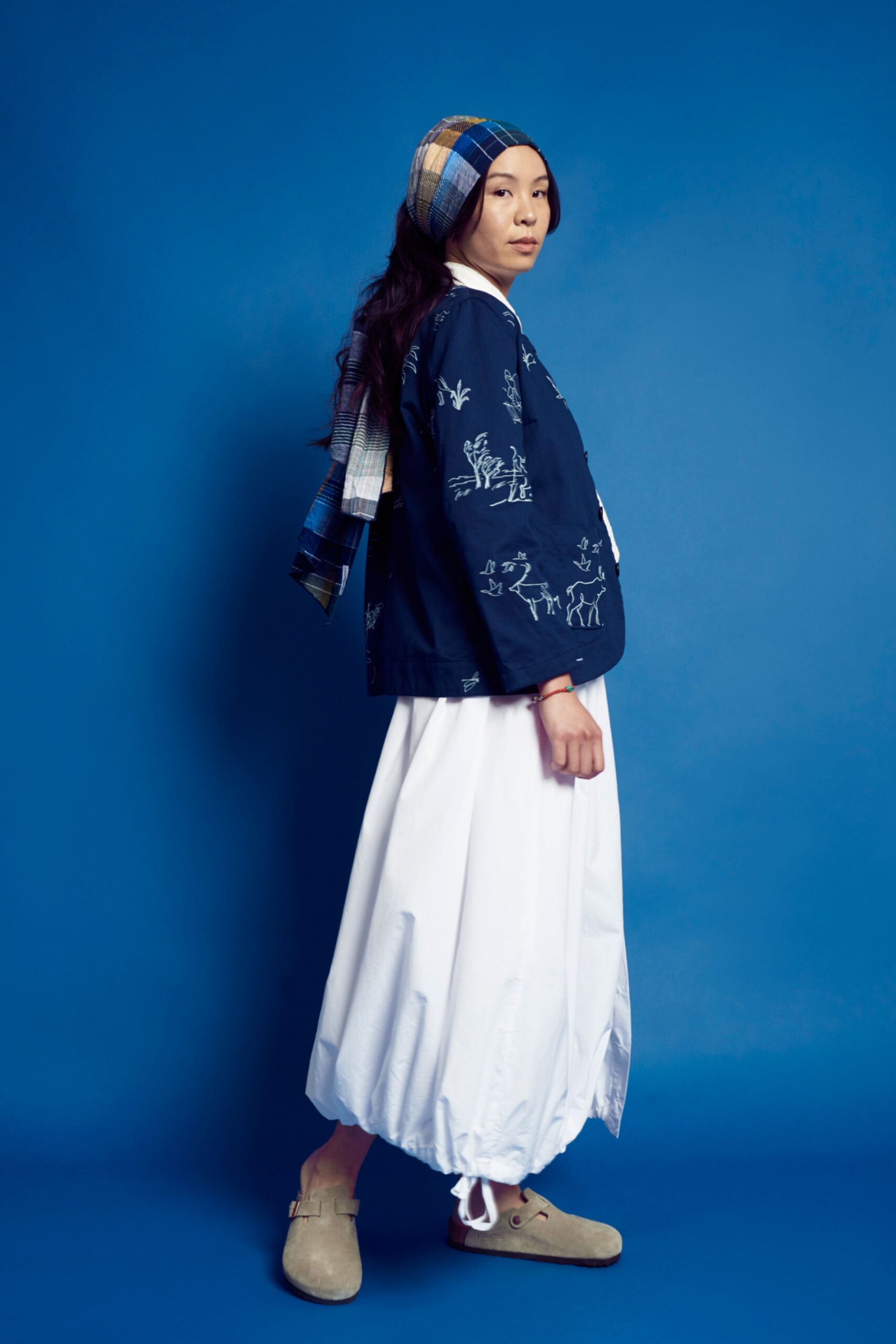 blue embroidered jacket white skirt