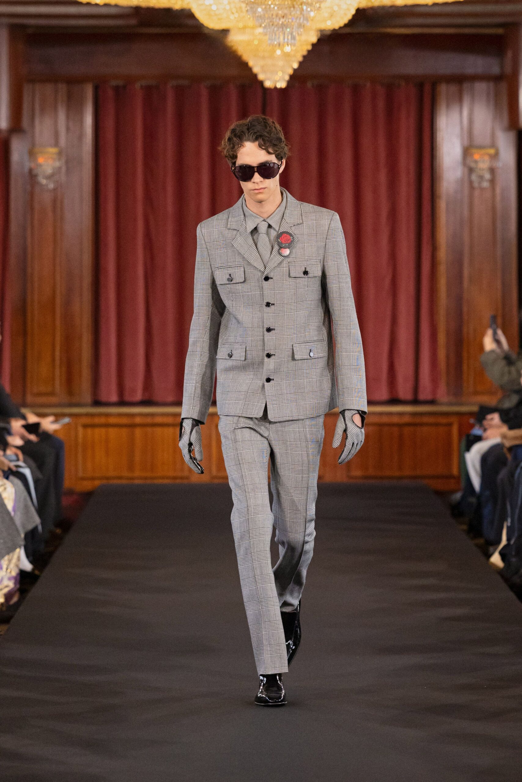 gray tailored suit with sunglasses