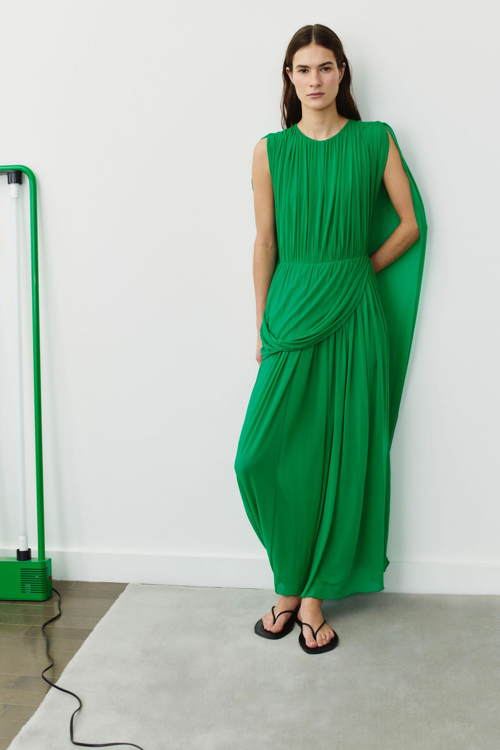 green chiffon sleeveless fitted pleated draped flowing gown
