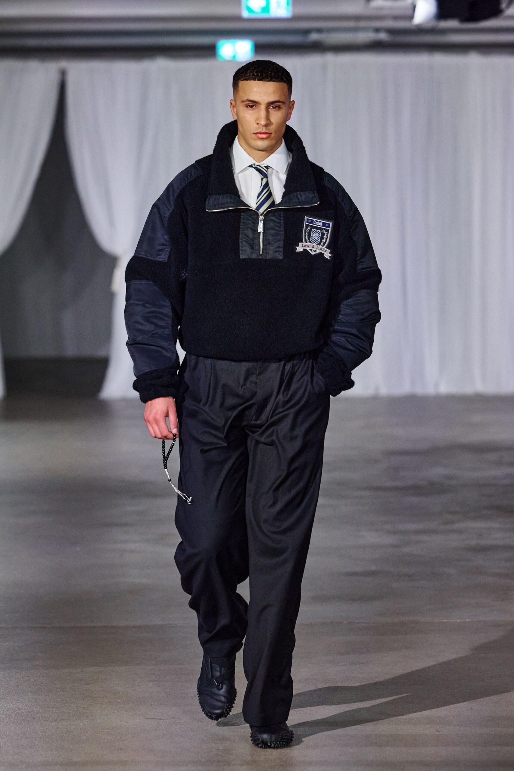black faux-fur jacket with tailored pants