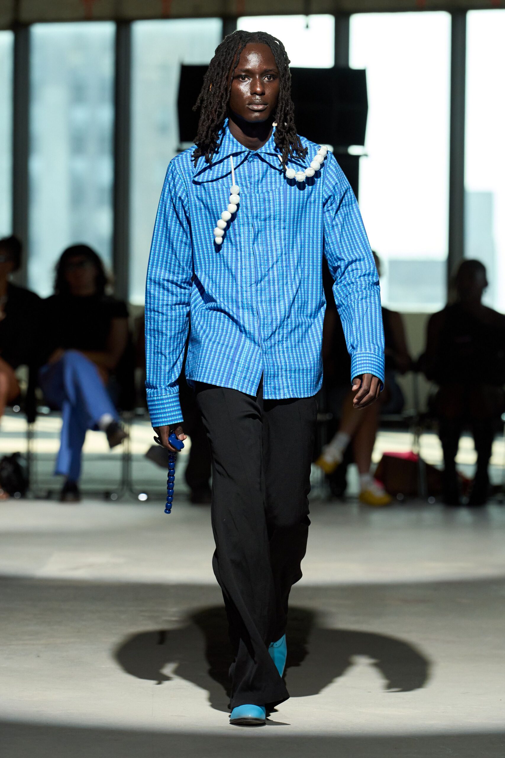 blue striped shirt black pants