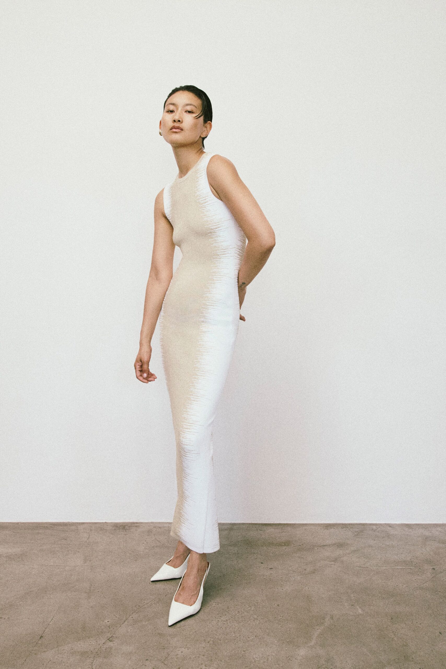 white silk sleeveless high-neck fitted textured maxi gown