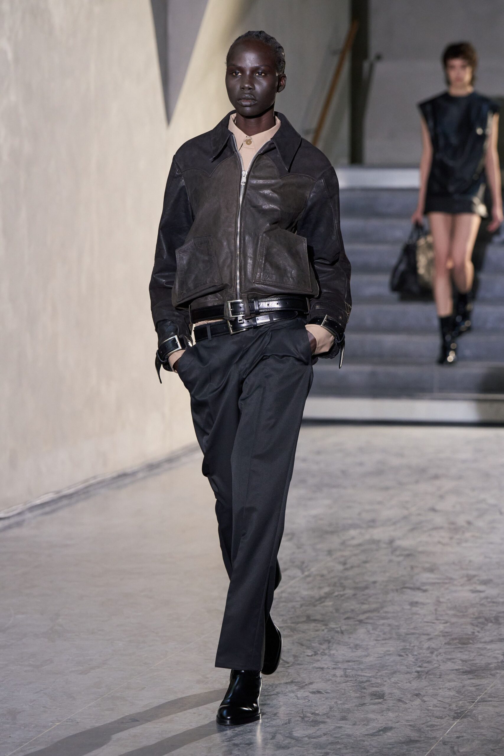 black leather jacket with beige shirt