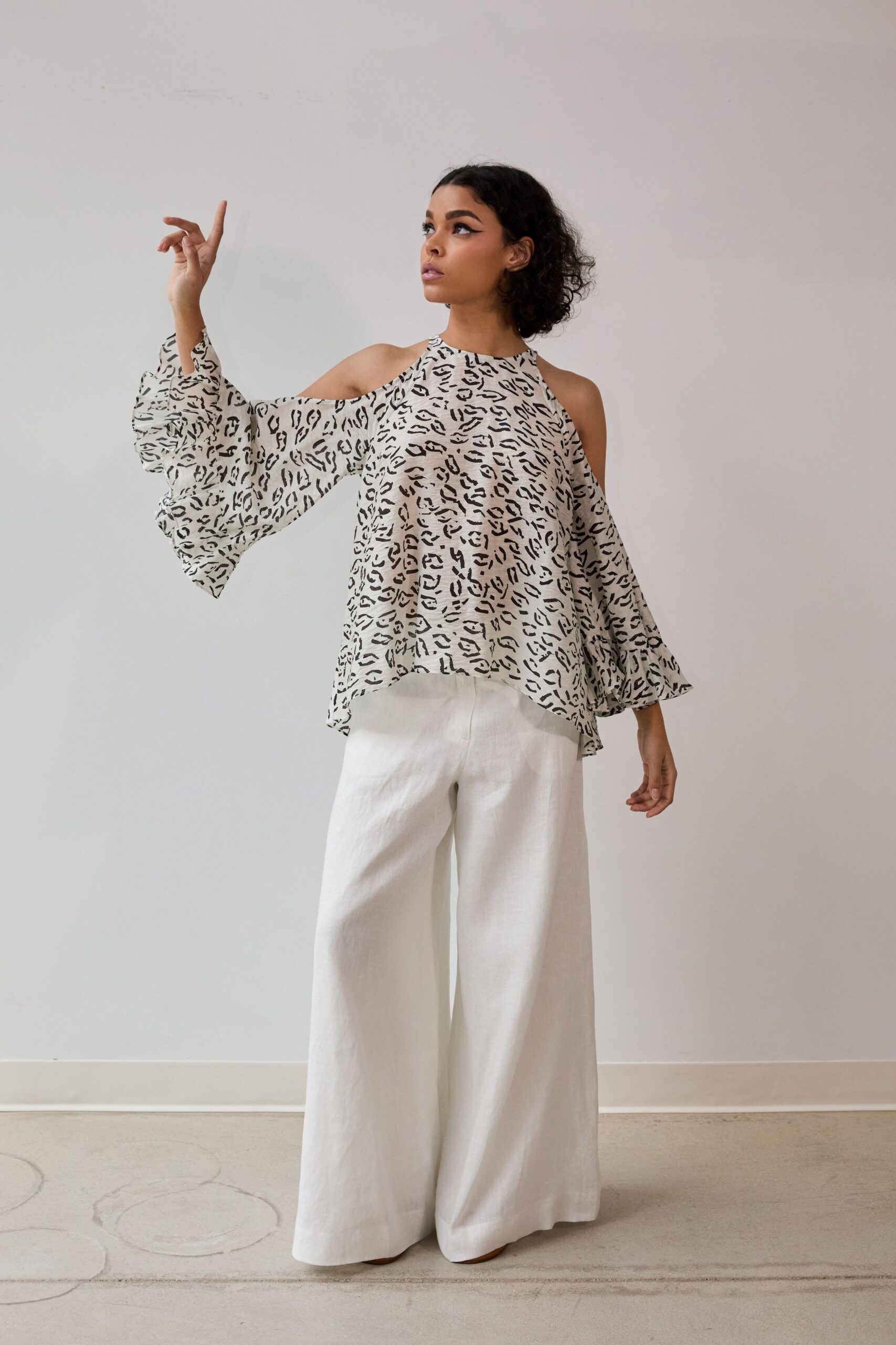 white chiffon sleeveless high-neck relaxed flared printed top