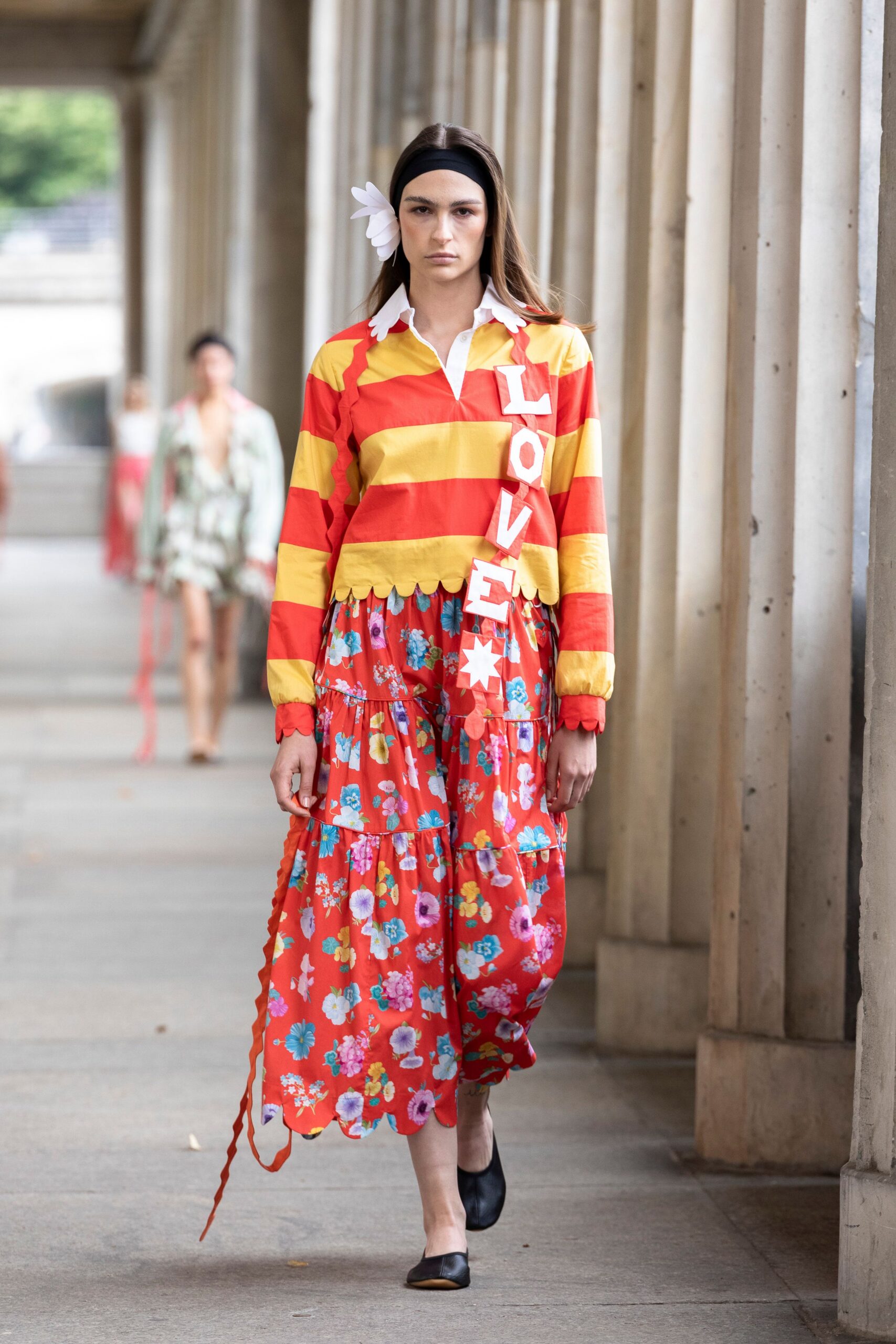 red striped shirt and floral skirt