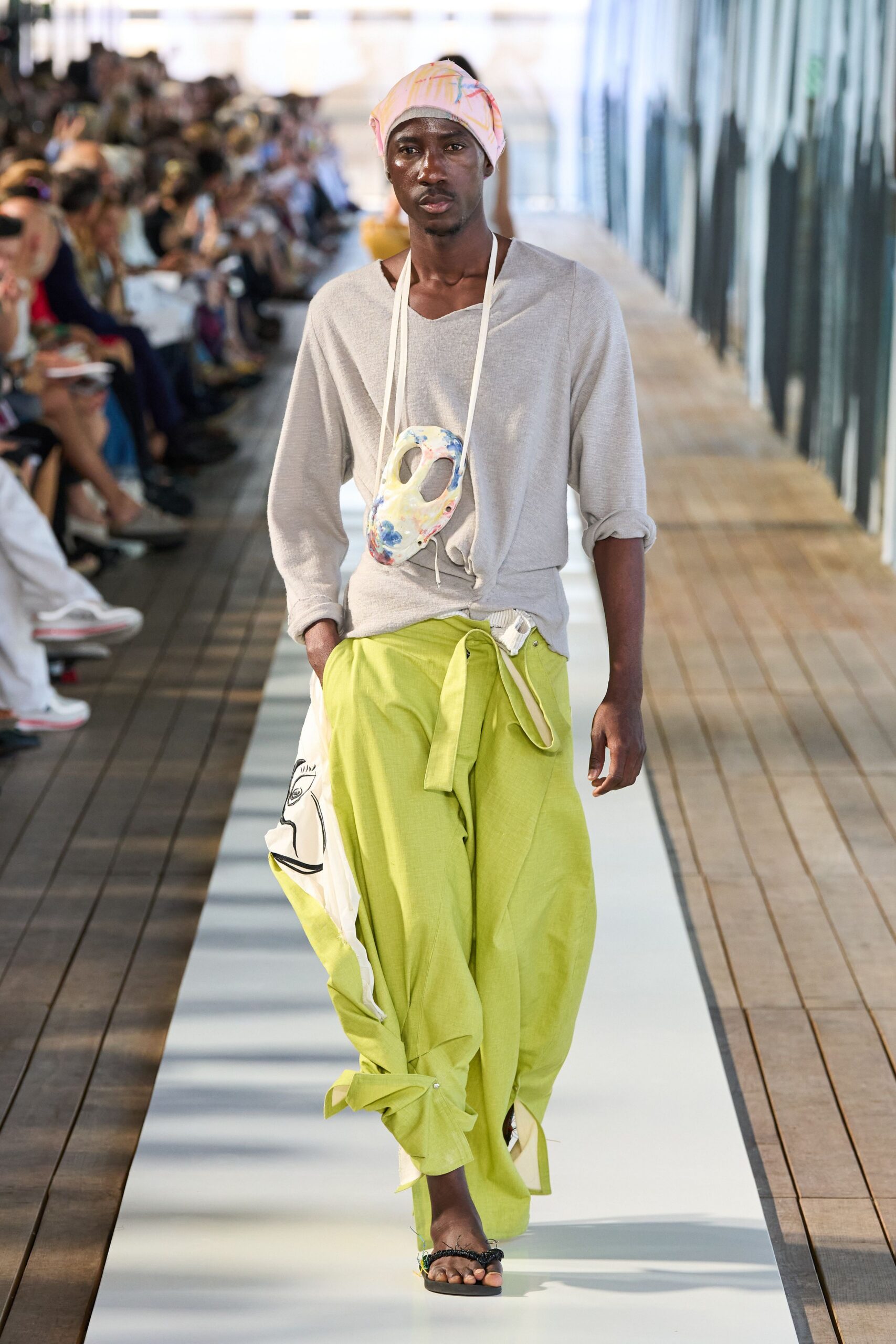 gray relaxed top with green pants