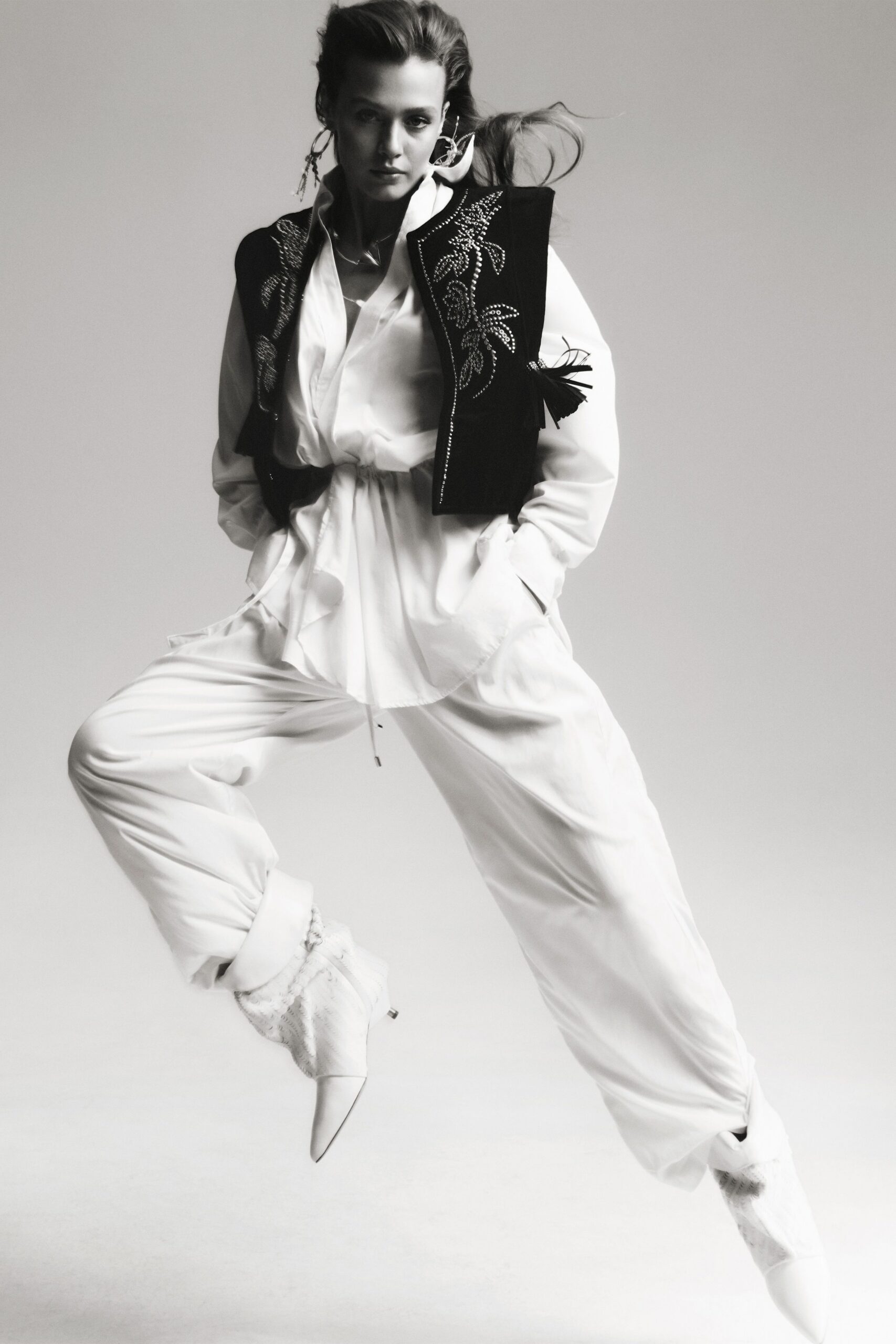 black embroidered vest white shirt pants