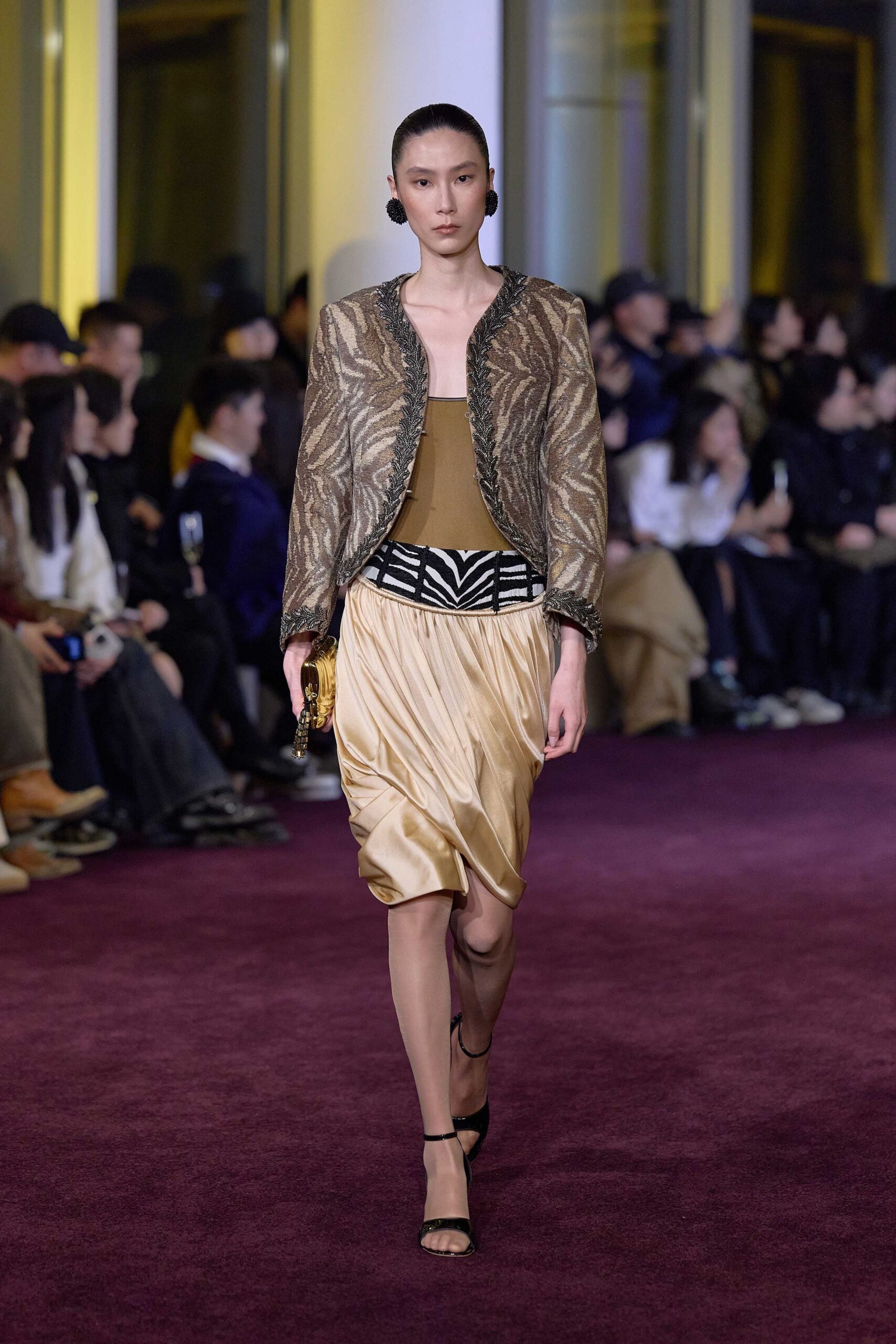 gold embroidered jacket with beige top