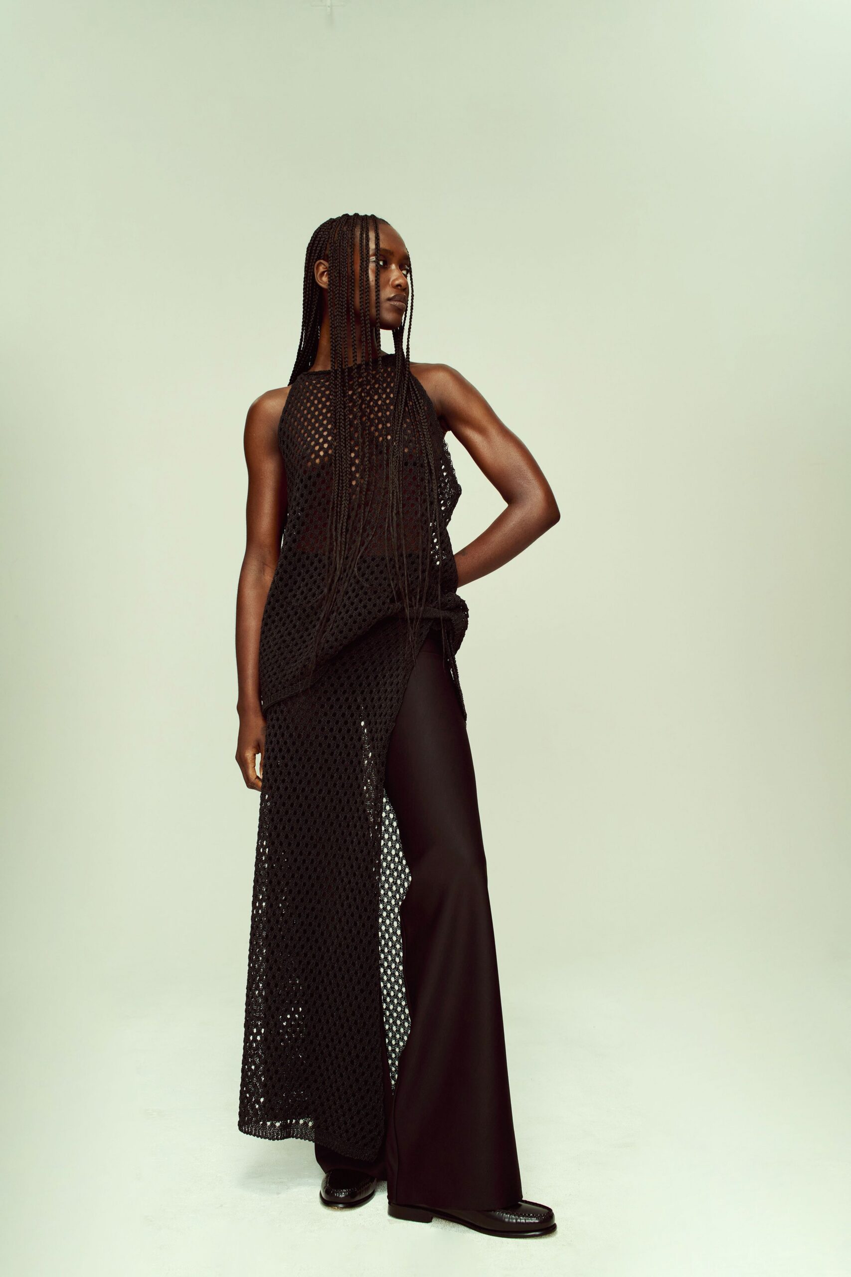 black mesh top and wide-leg pants