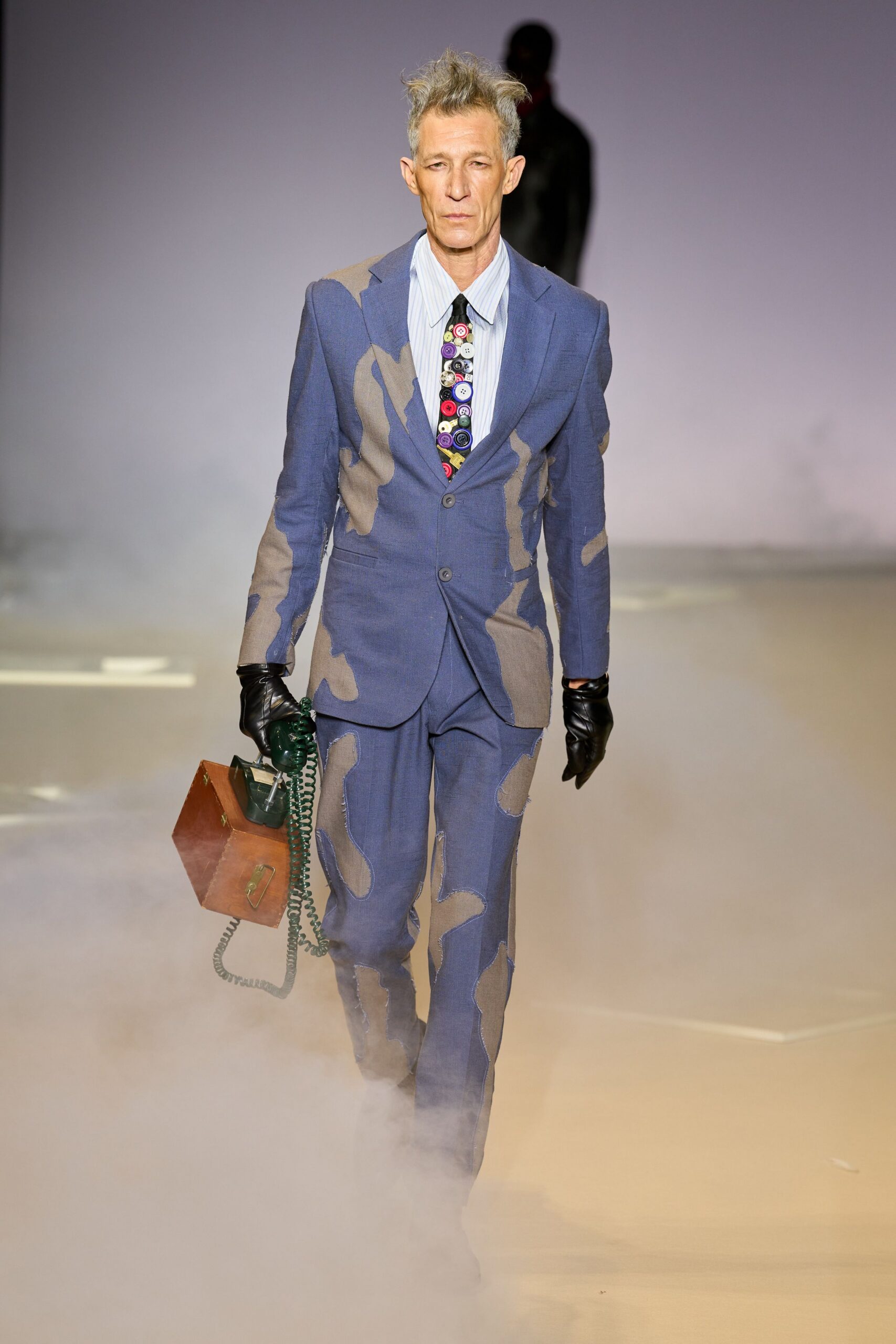 blue tailored suit with gloves