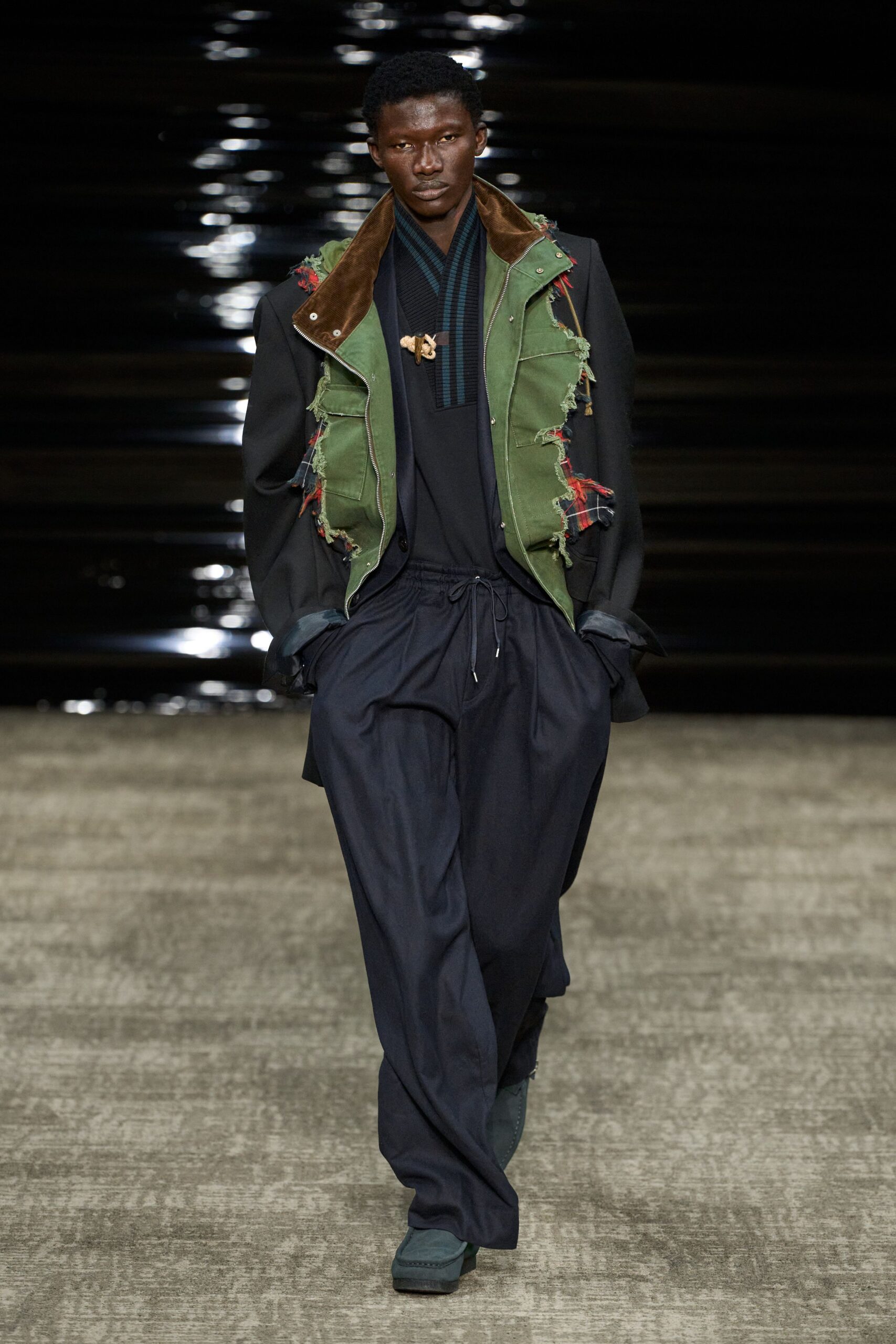 green jacket black top wide-leg pants
